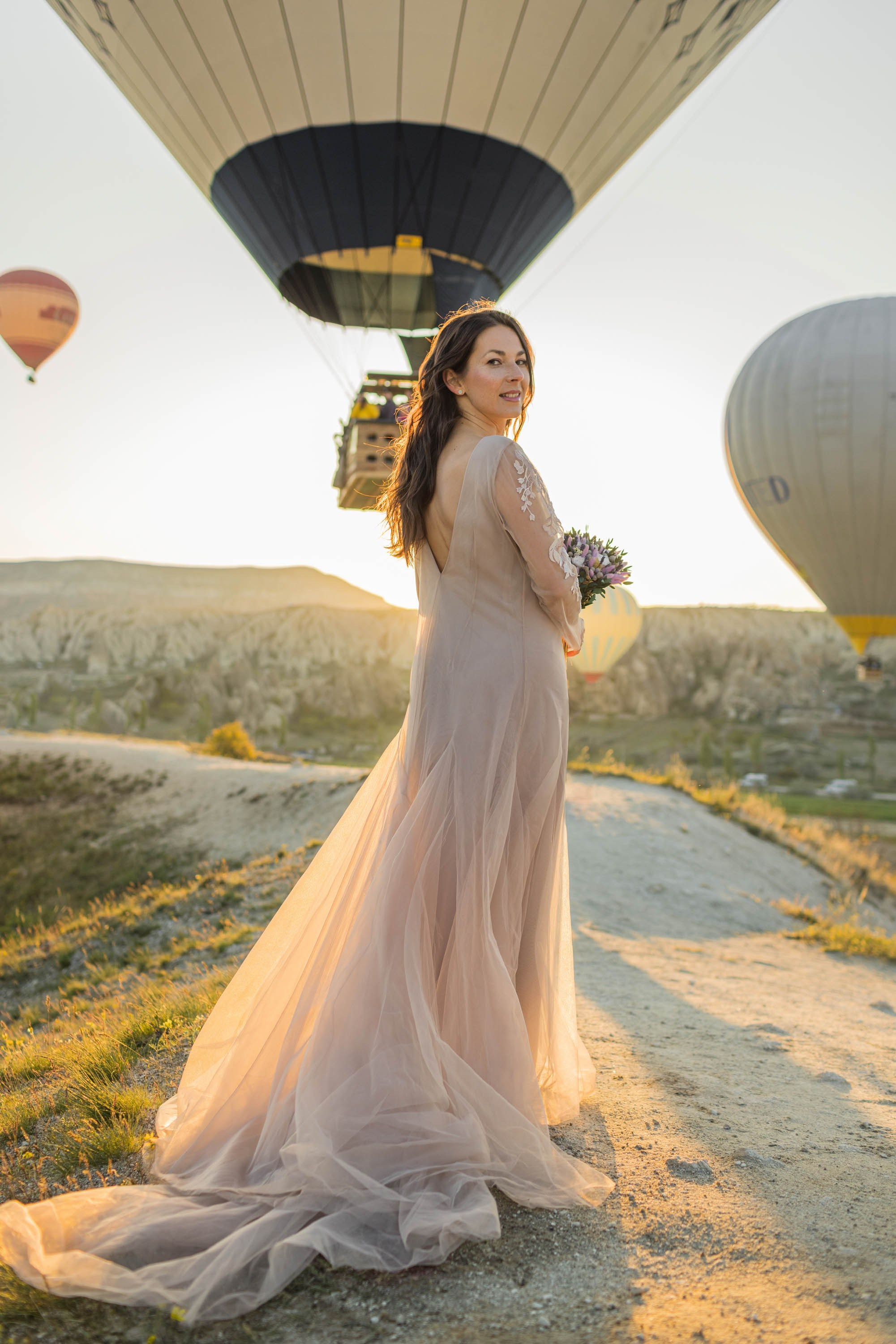 Magical Wedding Photoshoot in Cappadocia: Balloons, Caves, and Valleys. Julia Ganch I Fashion Wedding Photography I Cappadocia Turkey