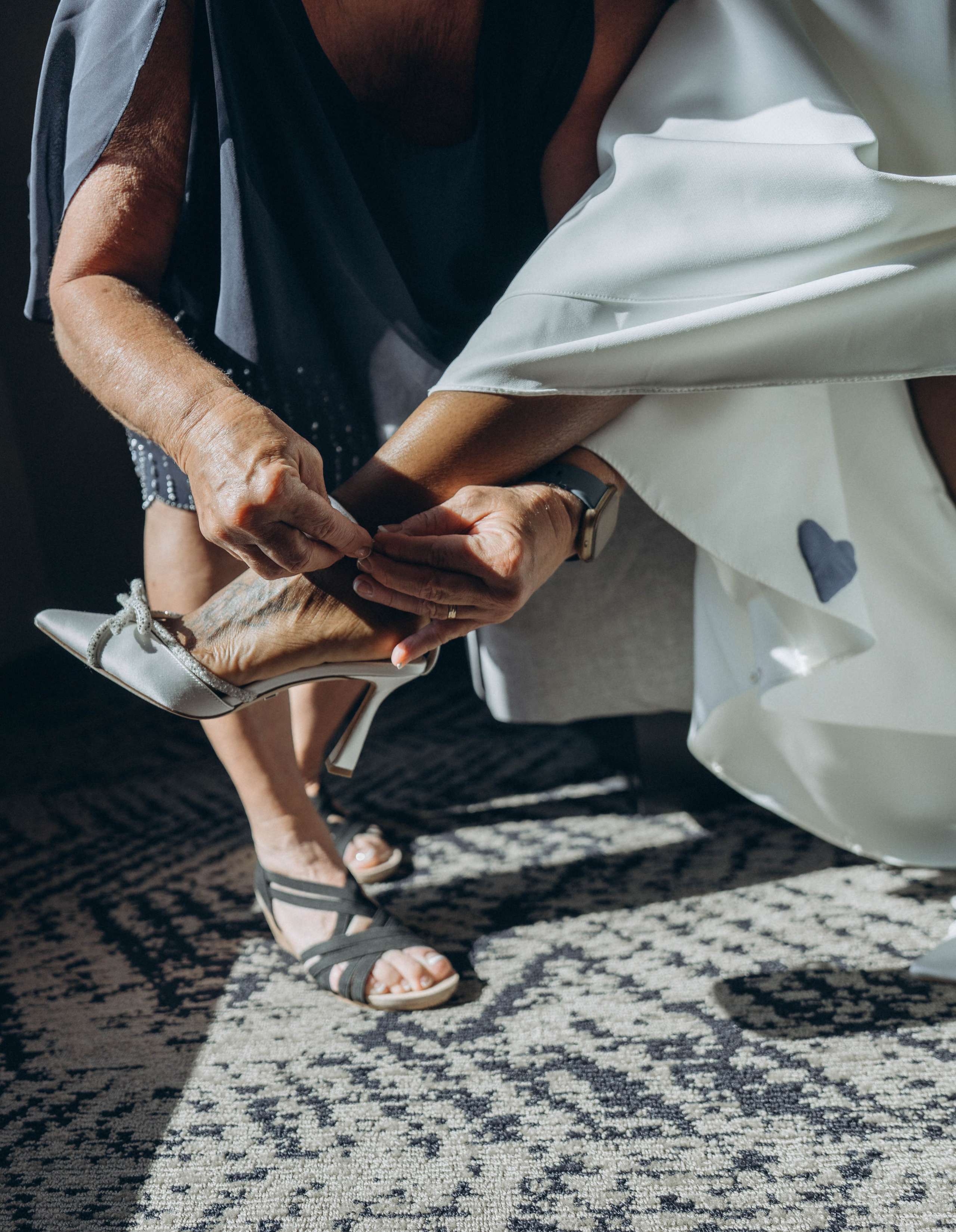 Bride smiling under Kingston bridge with Hudson River view.