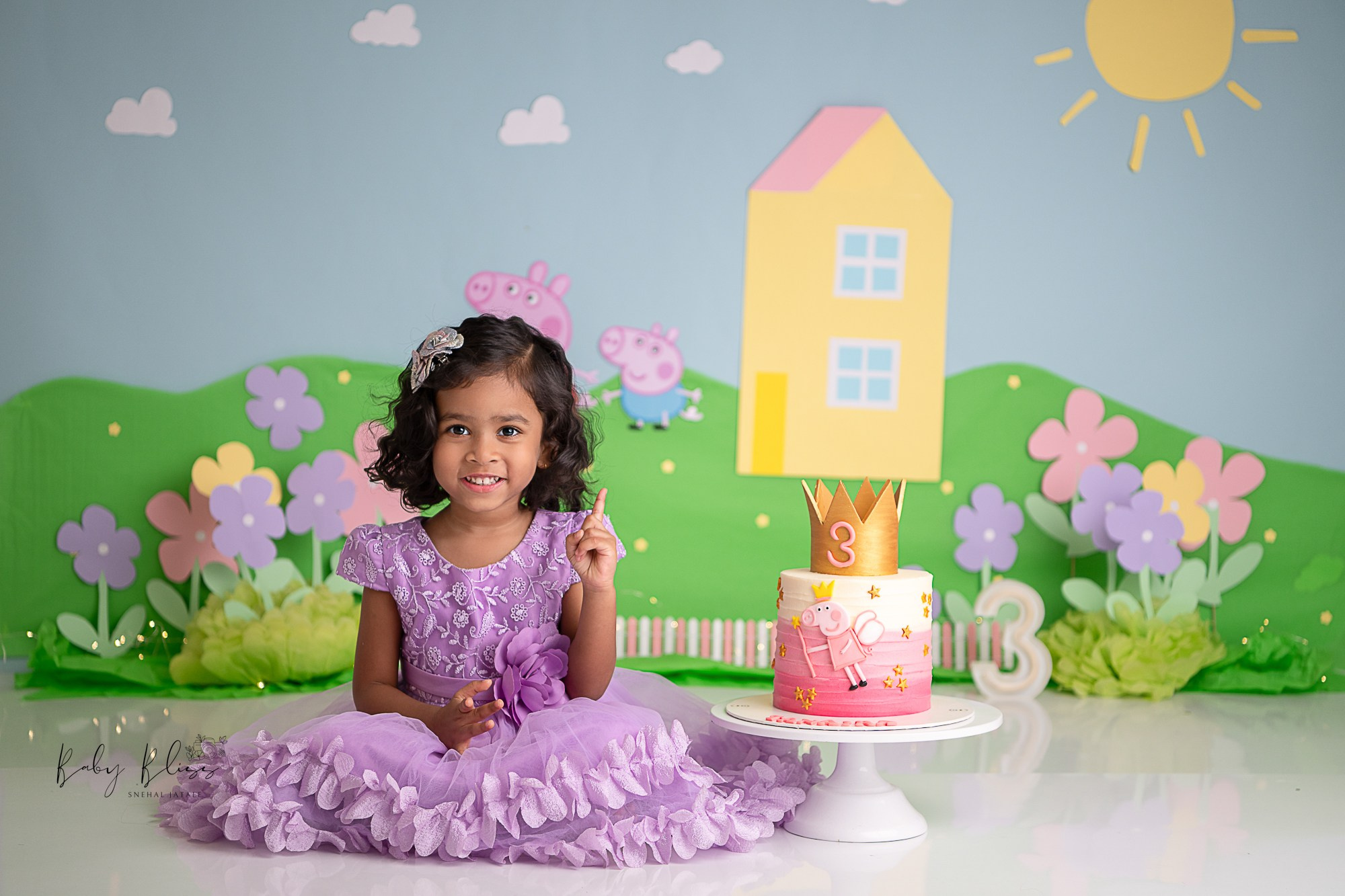Pepa pig themed cake smash setup for adorable three years old girl.