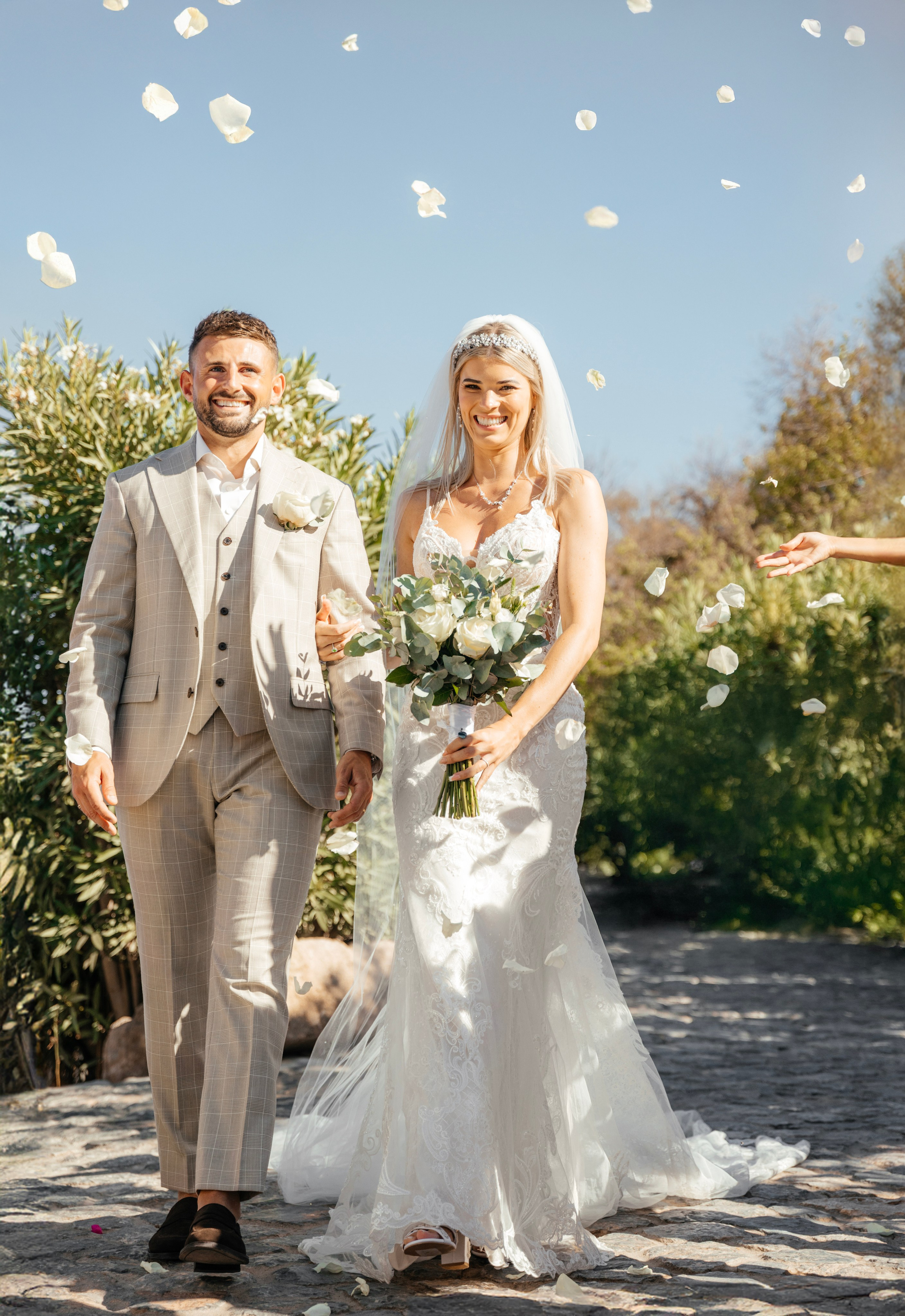 The couple is happy after the ceremony in Lindos, Rhodes, Greece
