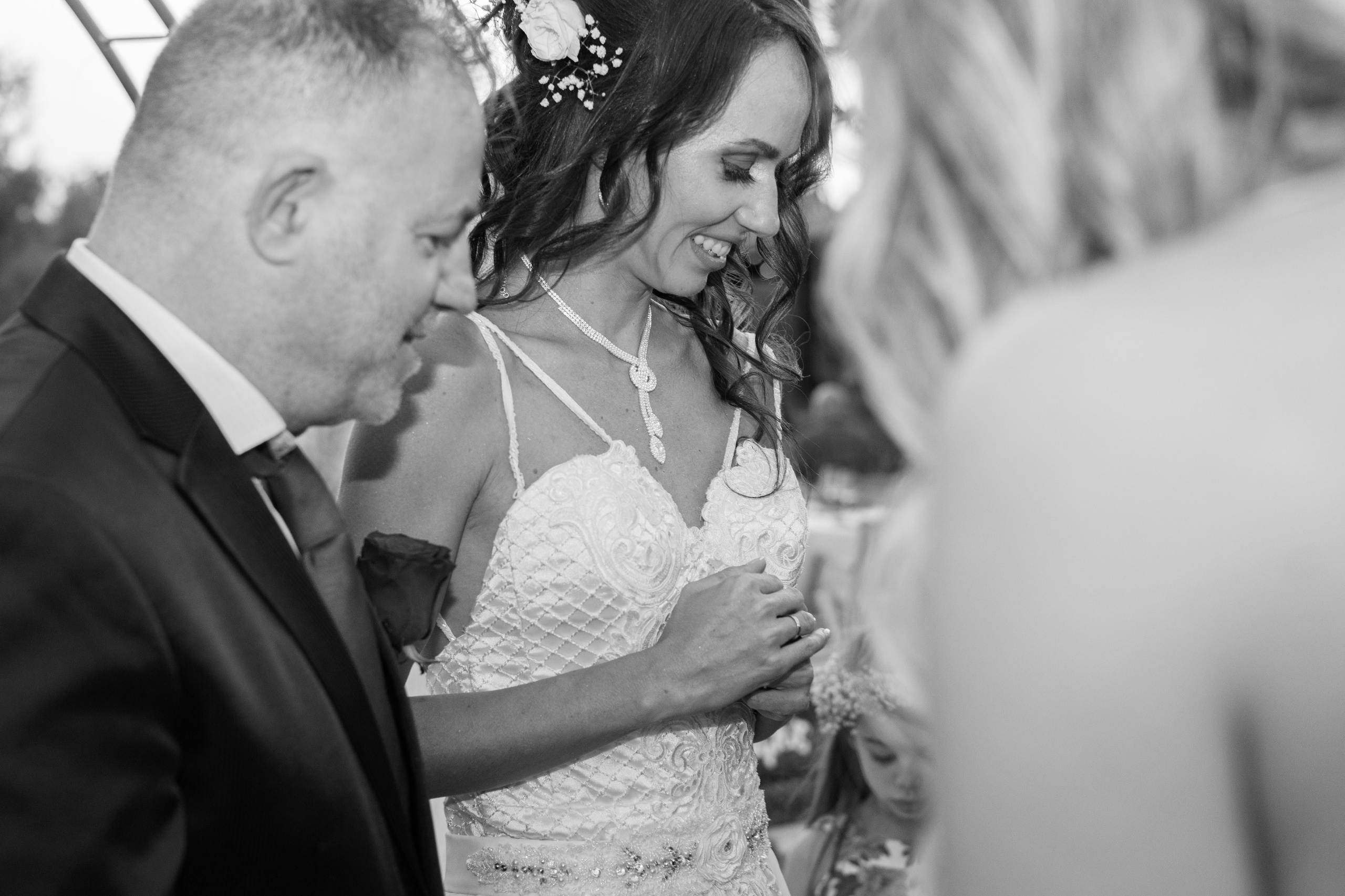 Bride and groom embracing during their wedding ceremony