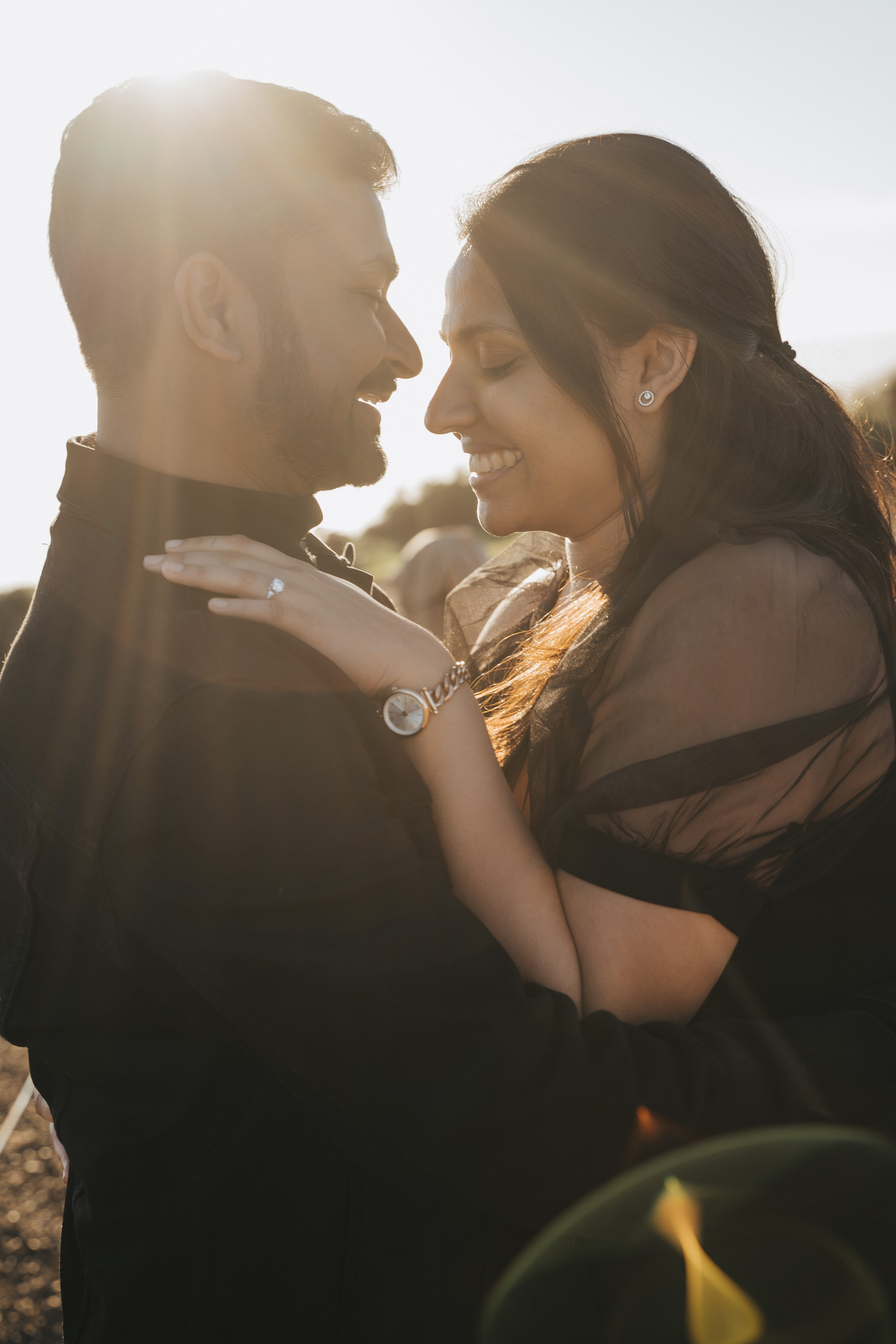 Proposal.  Overlooking the golden San- Franisco Bridge sunset with a couple. Photographer Video. 