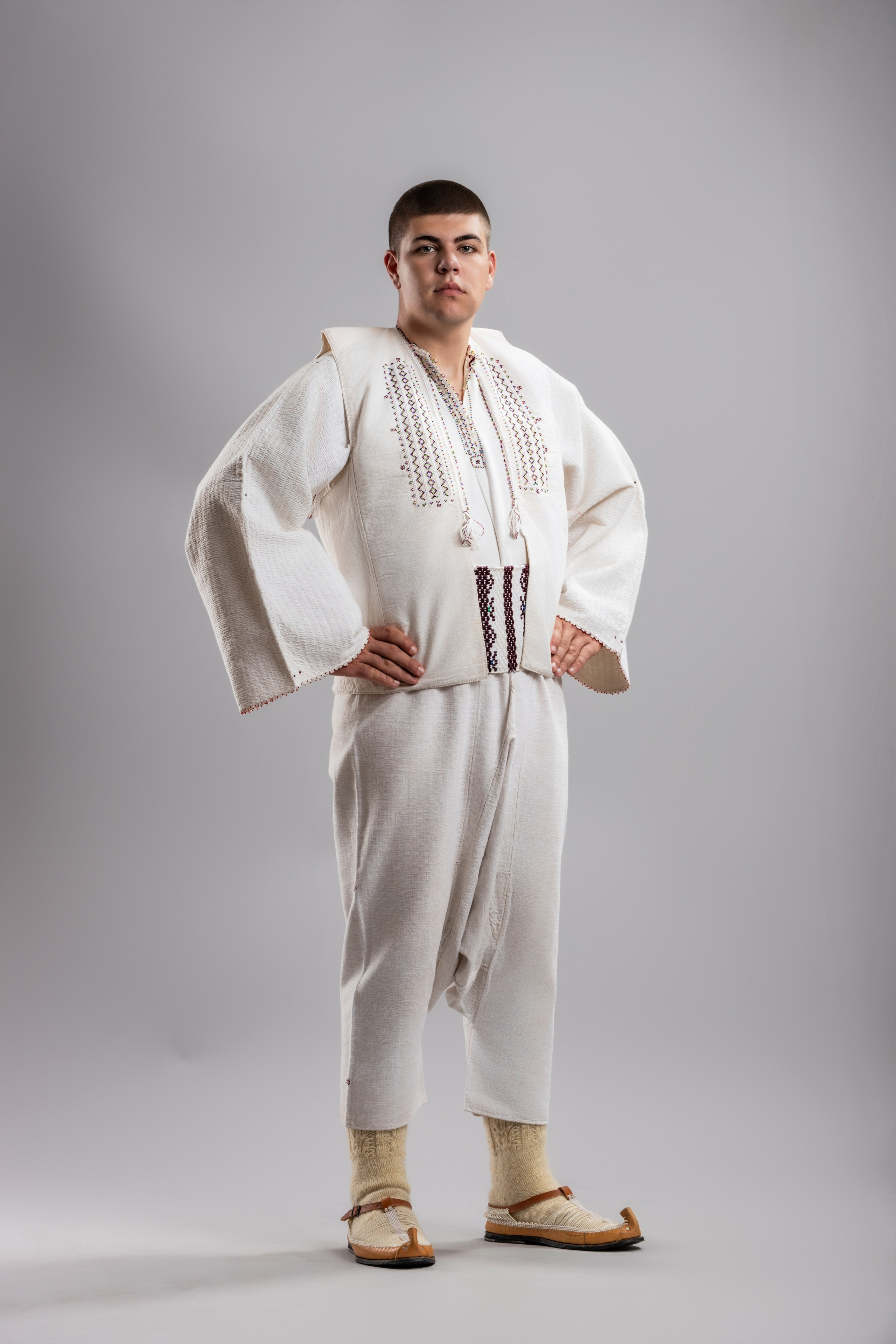 Studio portrait photography of traditional folk costumes from Bosnia and Herzegovina featuring authentic cultural clothing, embroidery, jewelry and handcrafted garments, photographed by Namir Čomaga. The images highlight the richness, craftsmanship and cultural heritage of Bosnian traditional costumes through carefully lit studio portraits.