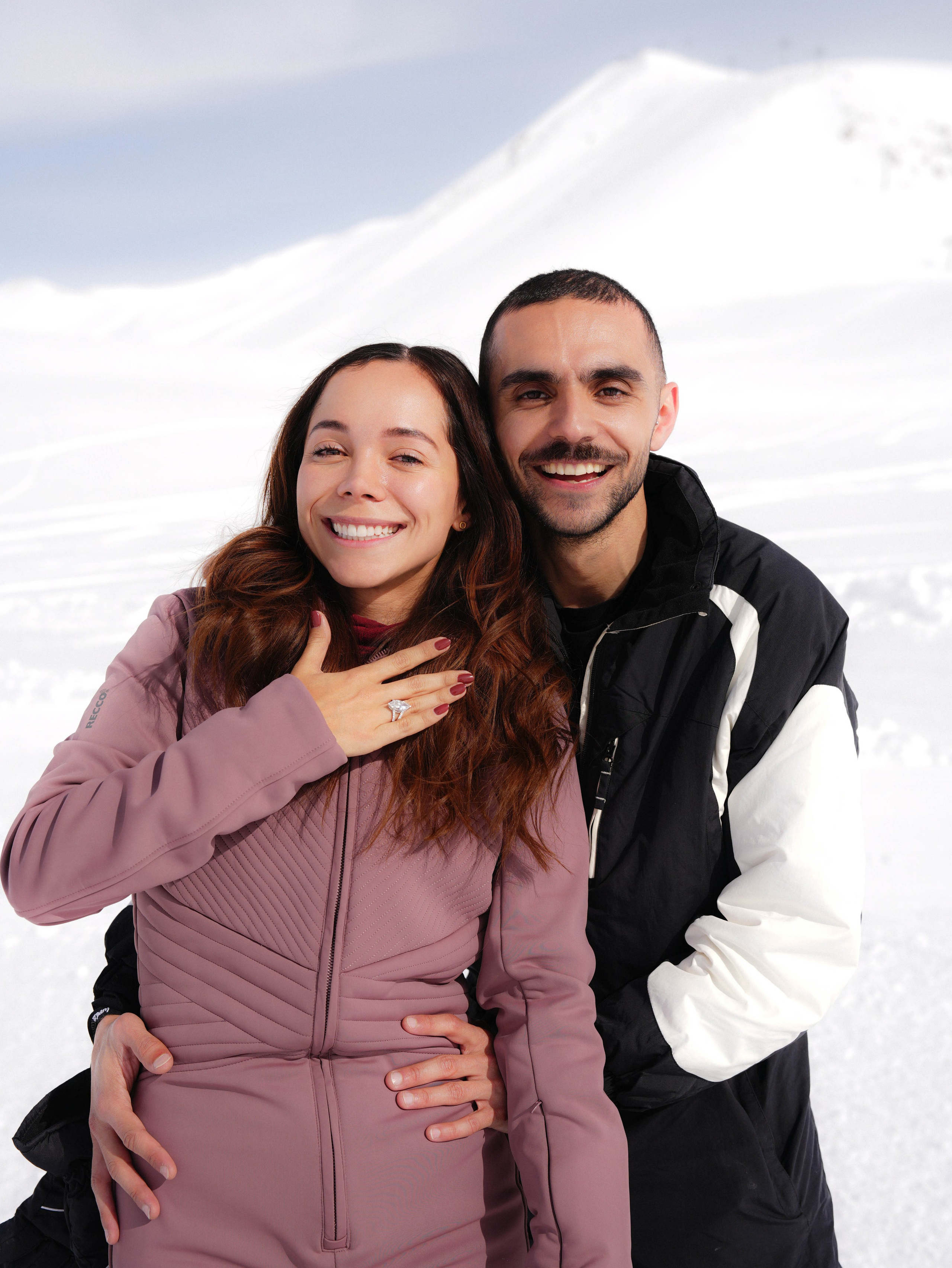 Woman showing engagement ring after proposal