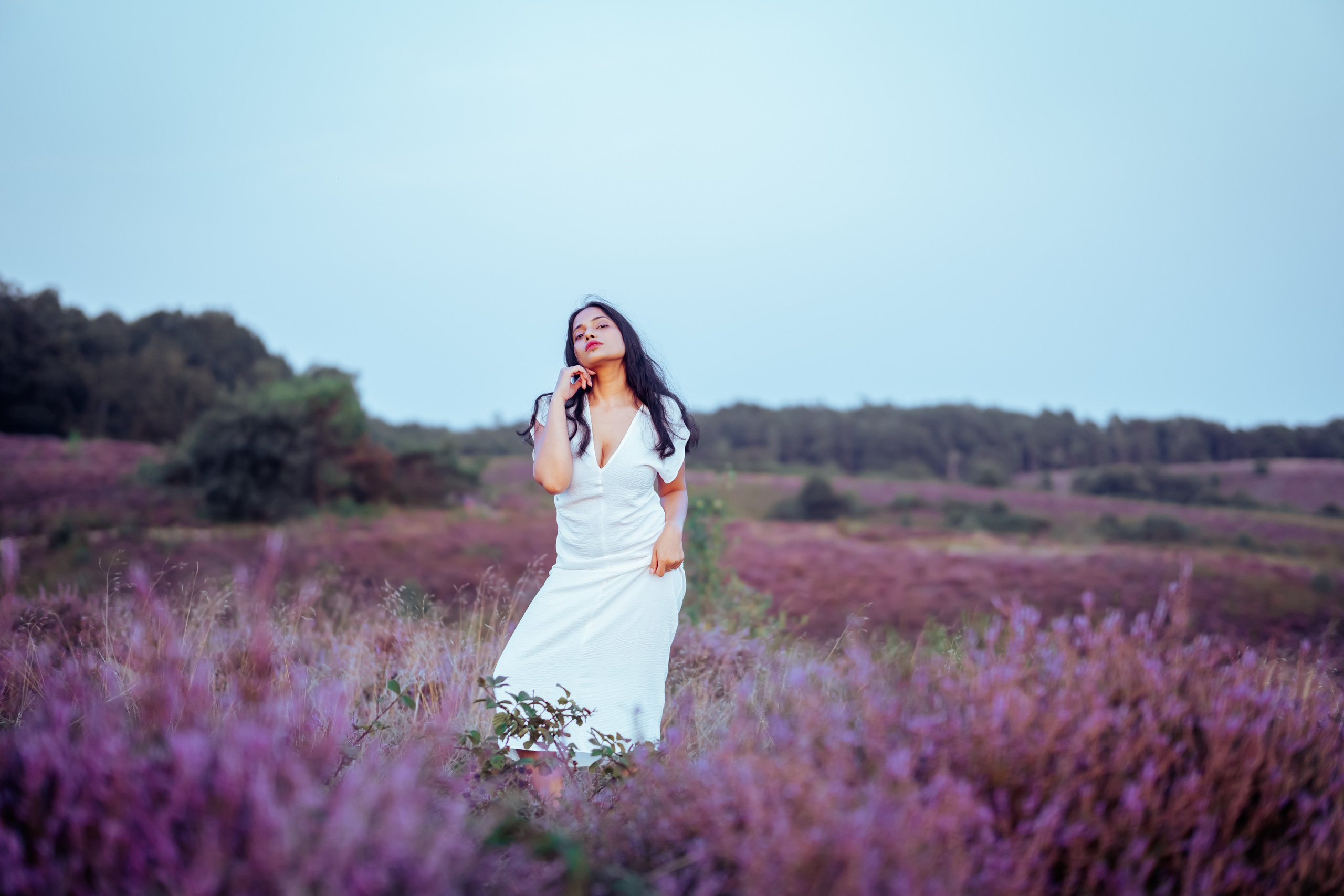 woman standing in veluwe heather fields netherlands