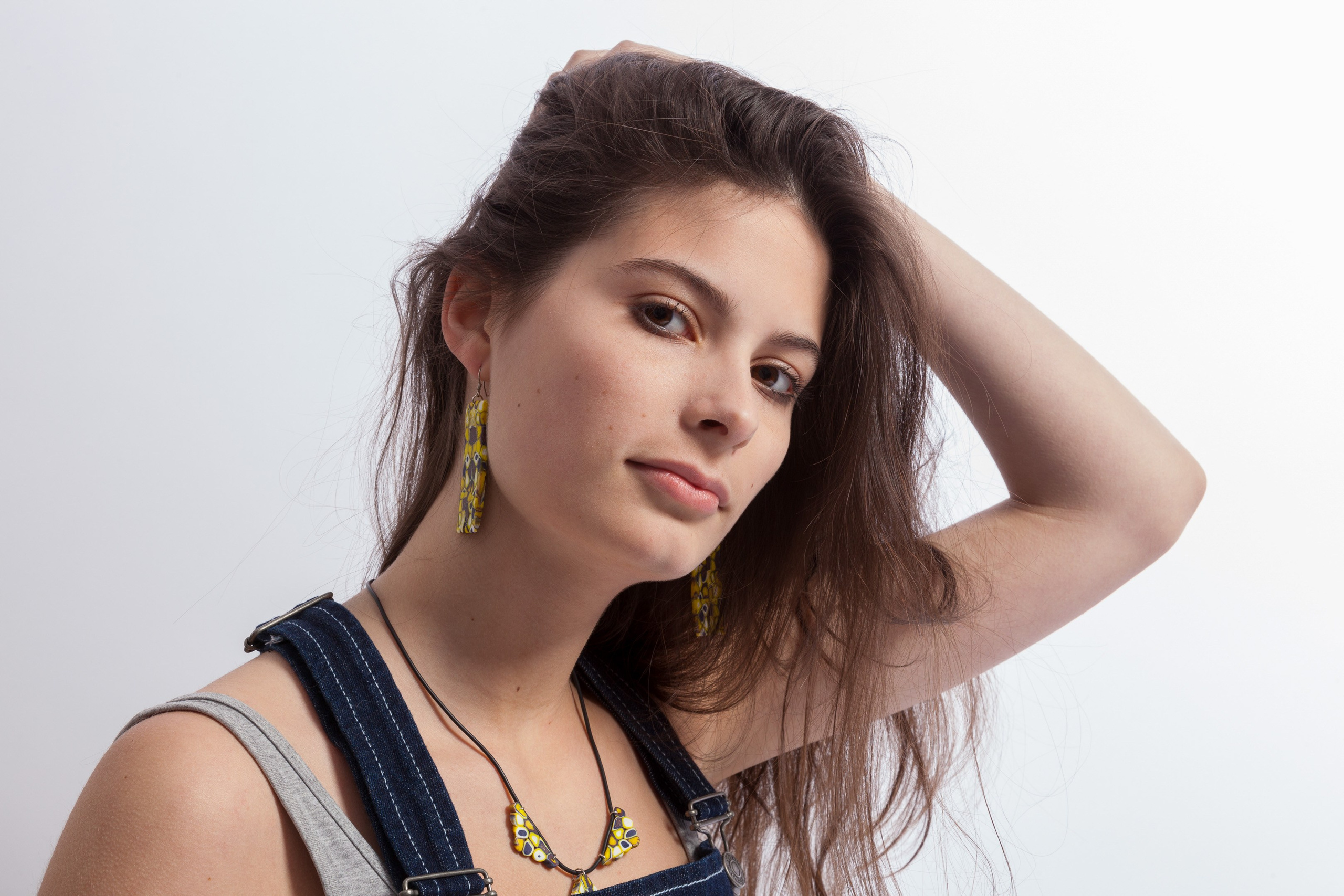 Portrait of a young girl on white studio background - photographer Andrey Dunin