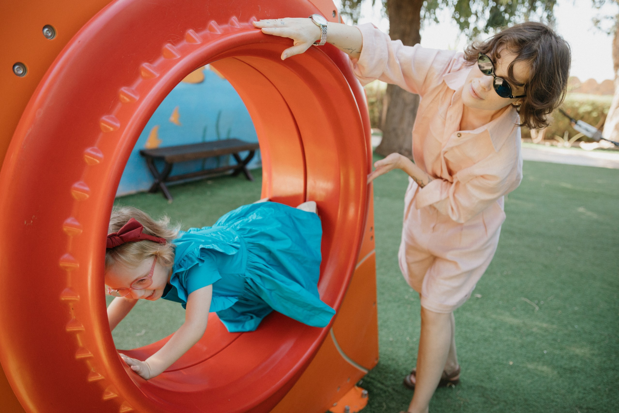 Joyful Moments in Camel park: Olya and Ada’s Day of Fun and Adventure, sliding and riding camels. Photographer in Barcelona capturing unique stories | Kate Chumak