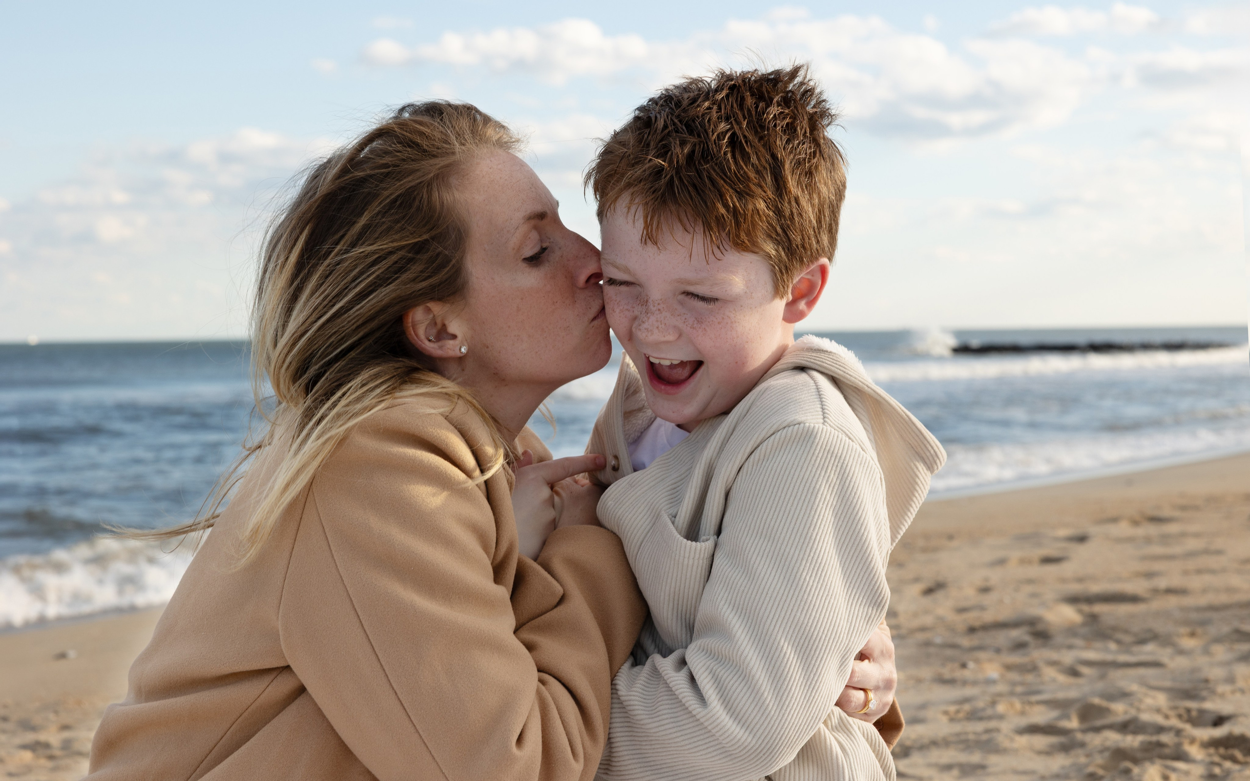 Sun, Sand, and Family Hugs. Family, lifestyle, and commercial photography in New York and New Jersey