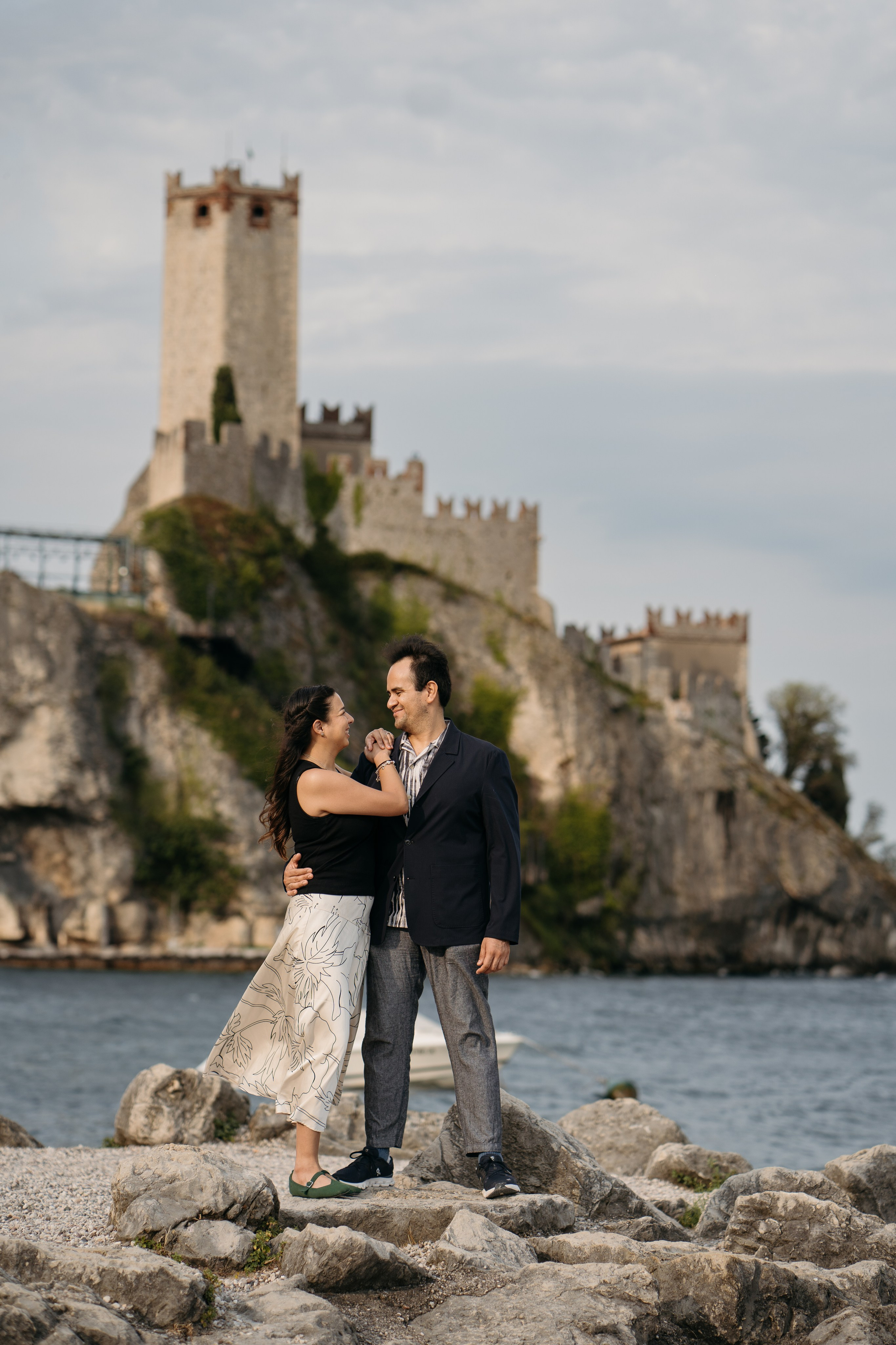 Surprise marriage proposal in Malcesine on Lake Garda with the historic castle in the background