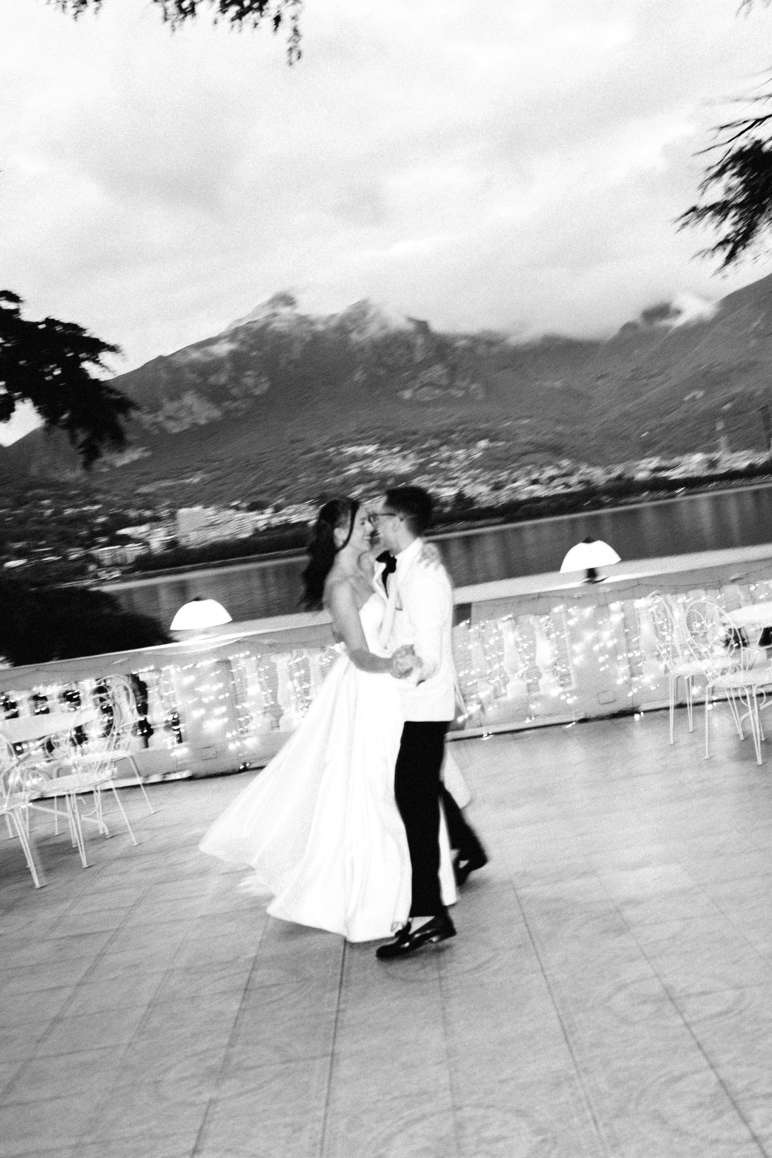 Bride and groom dancing with guests during their wedding celebration in Bellagio