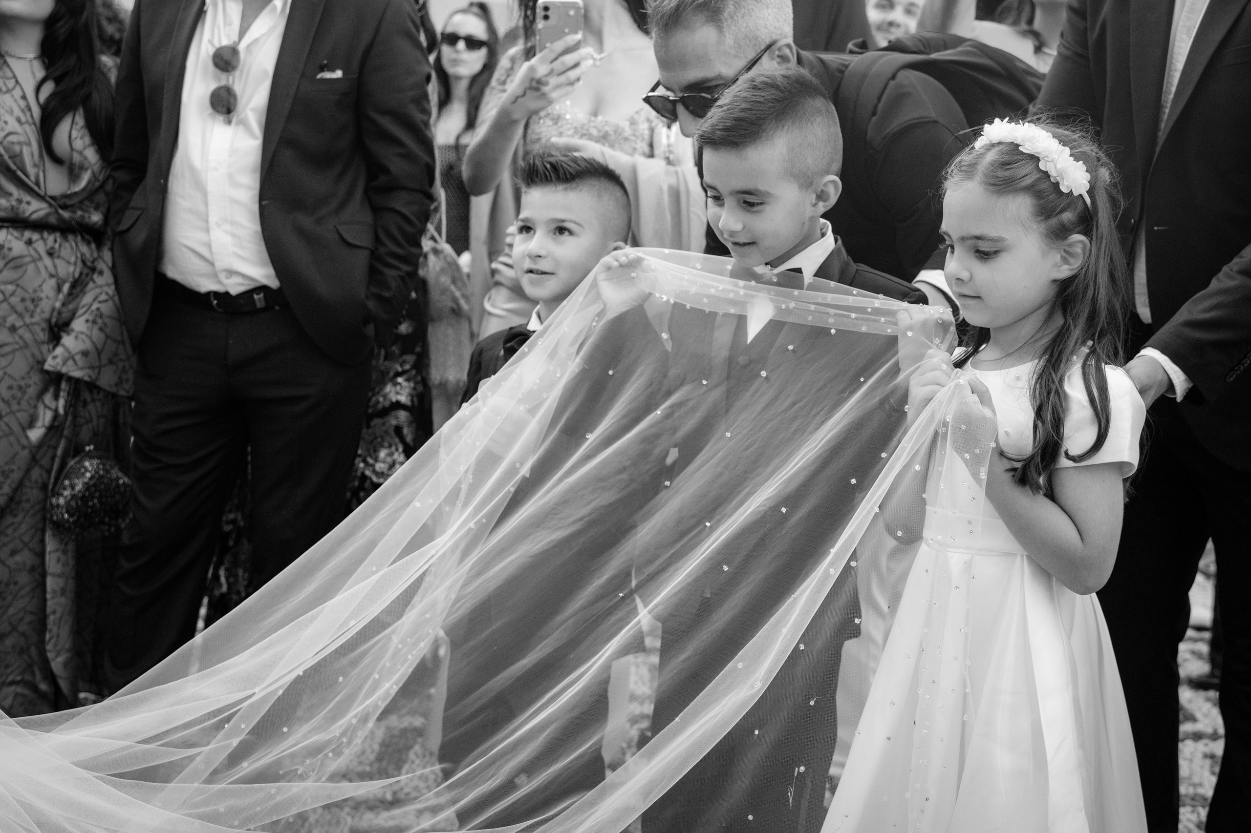 bridesmaids are carrying the vail of the bride. Rhodes Greece