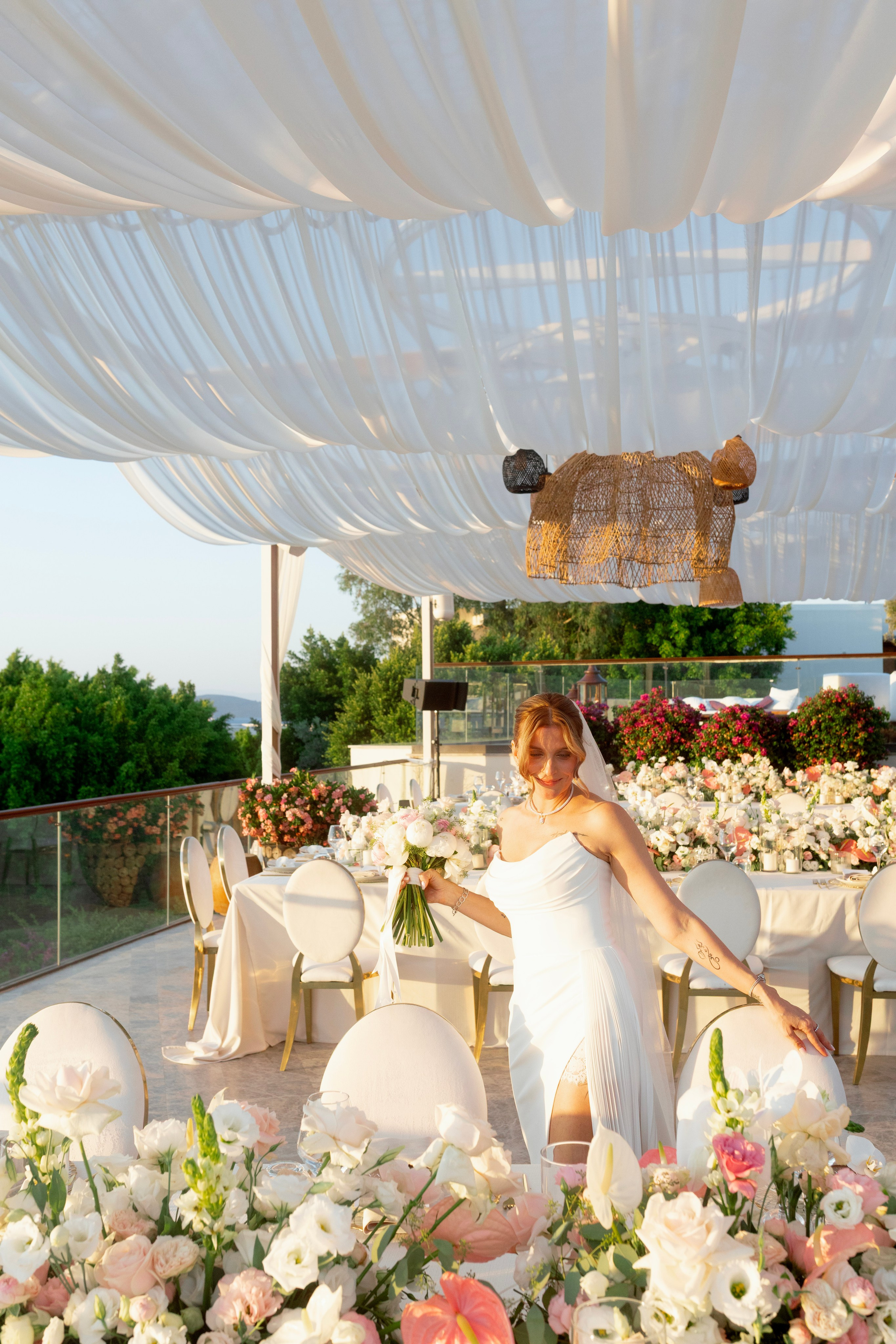 Bride beside a luxury floral wedding installation at Susona Bodrum