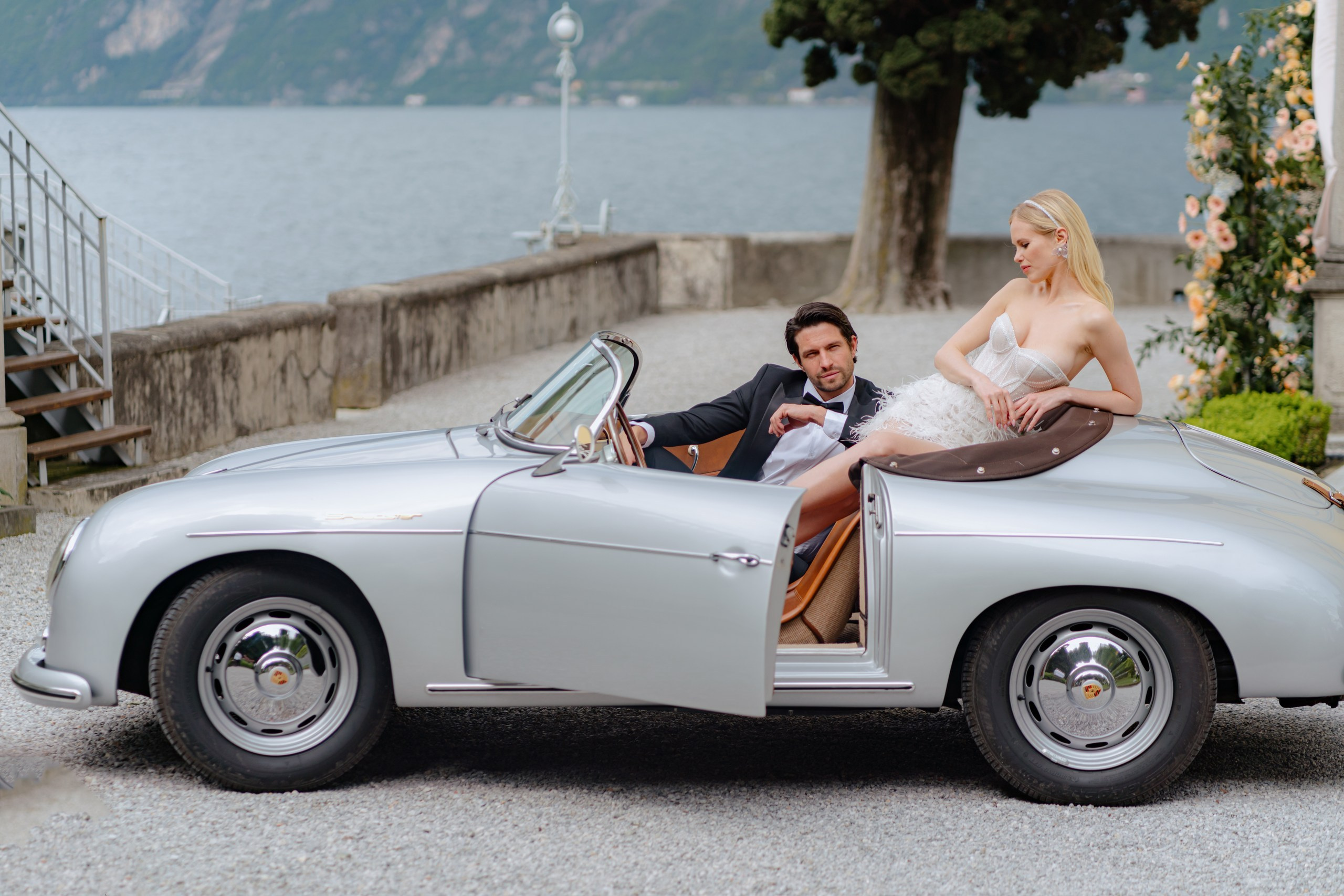 Bride and groom riding in cabriolet at Villa Aura Como wedding