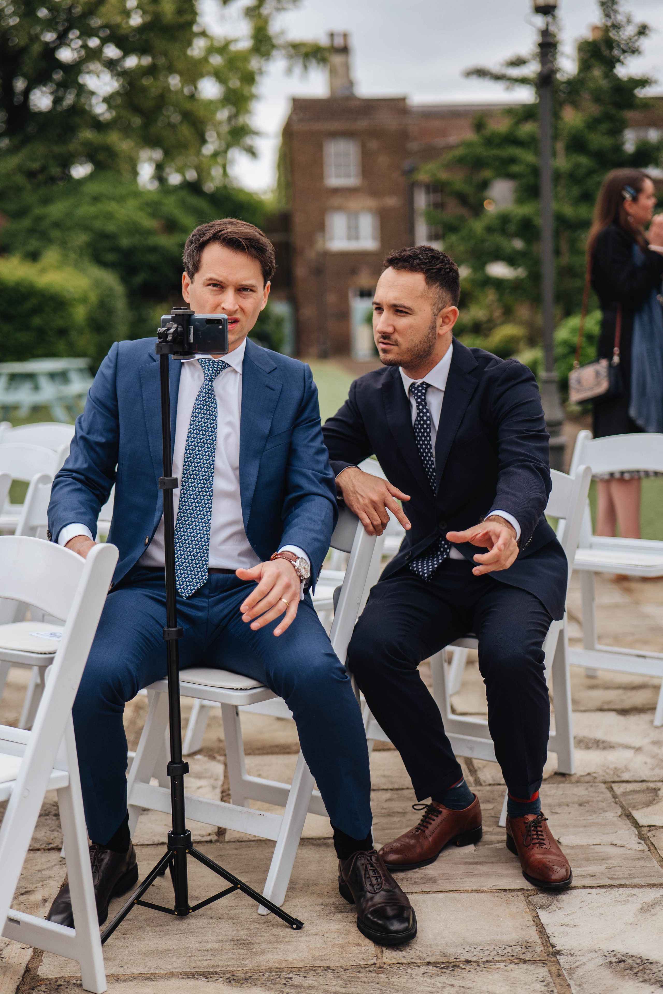 wedding guests prepare cameras before the wedding ceremony