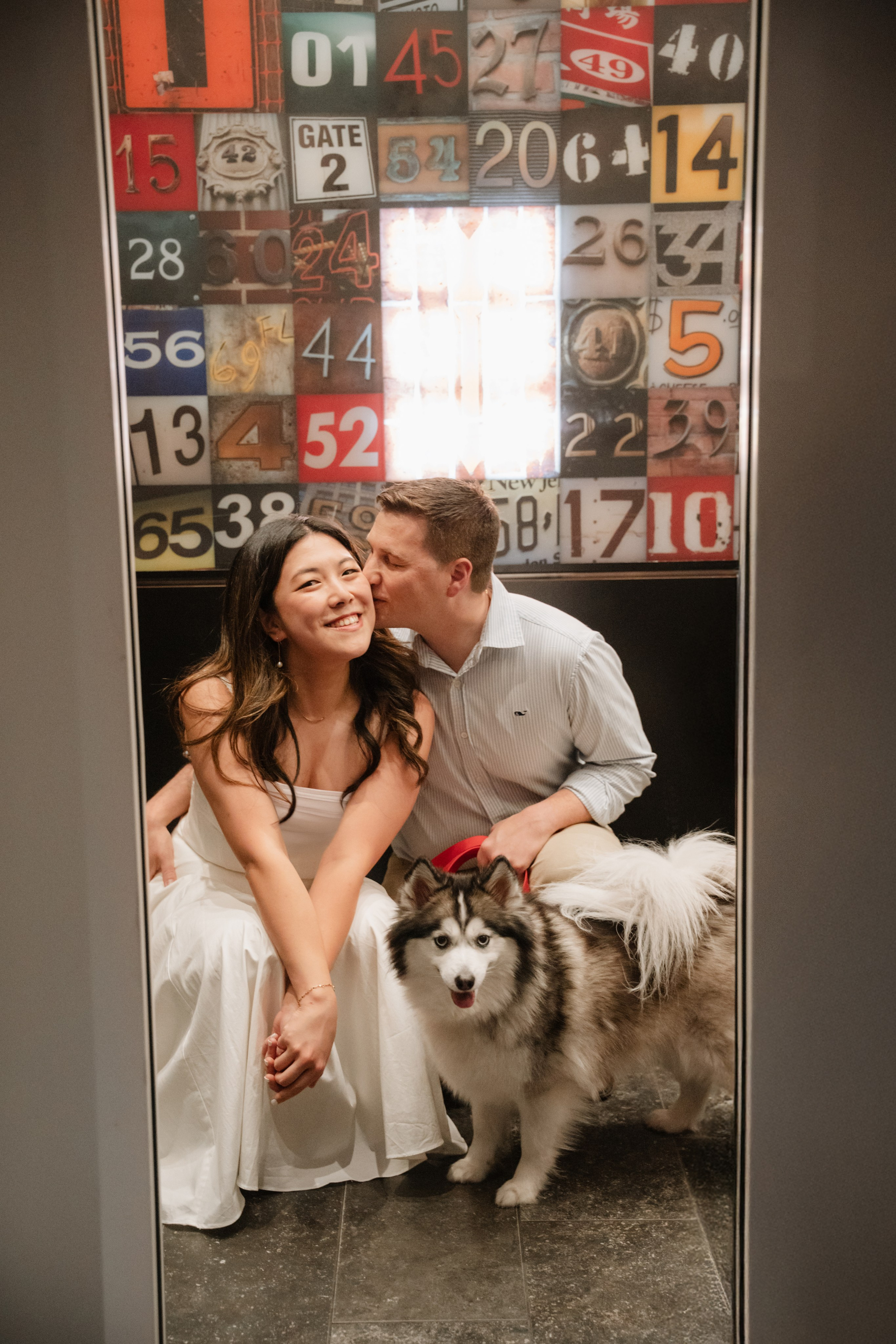 An adorable couple with their dog. Portrait and wedding photographer in New York