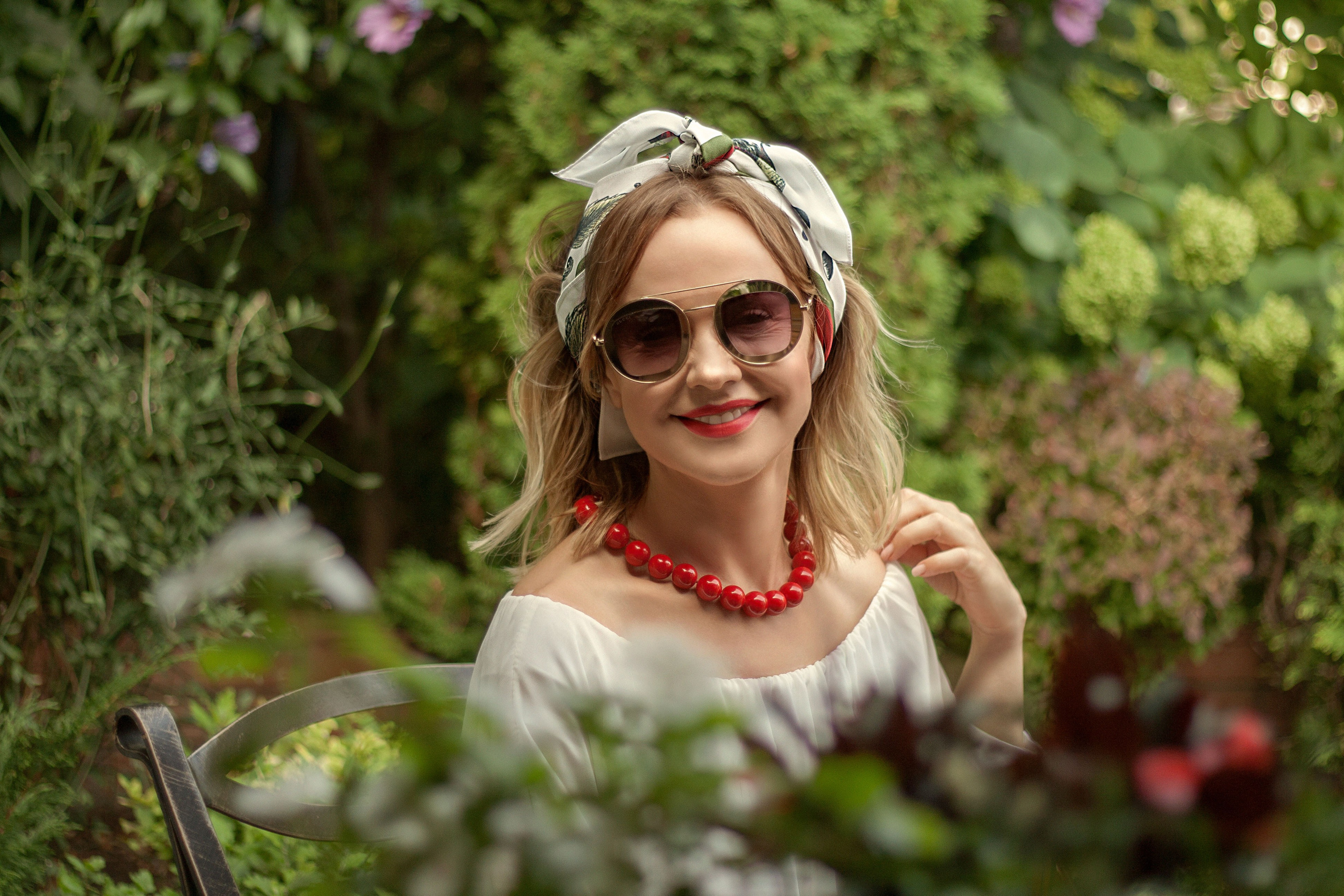 Portrait of a woman in a garden. Portrait and still life photographer. Designer, photographer, and illustrator