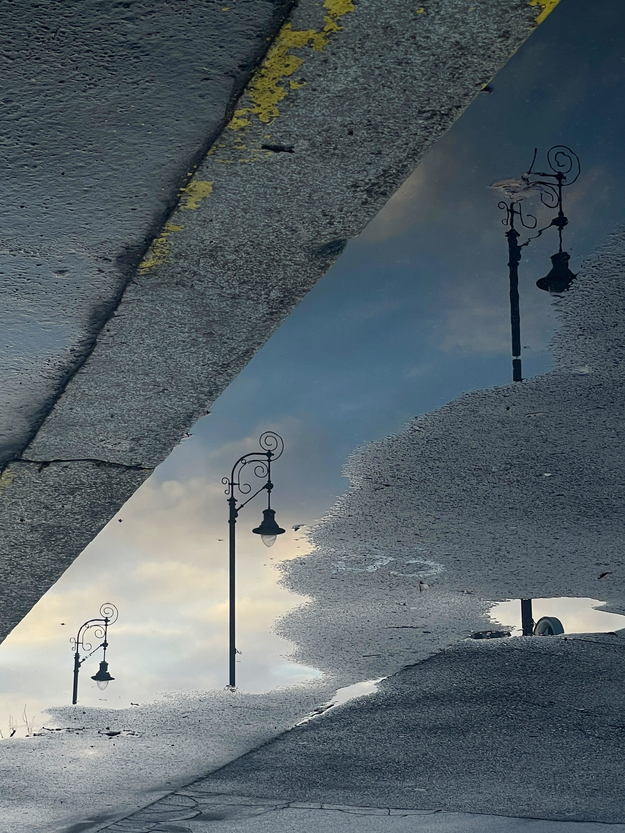reflection of streetlights in a puddle | Budapest 2026 | IPHONE 12 PRO
