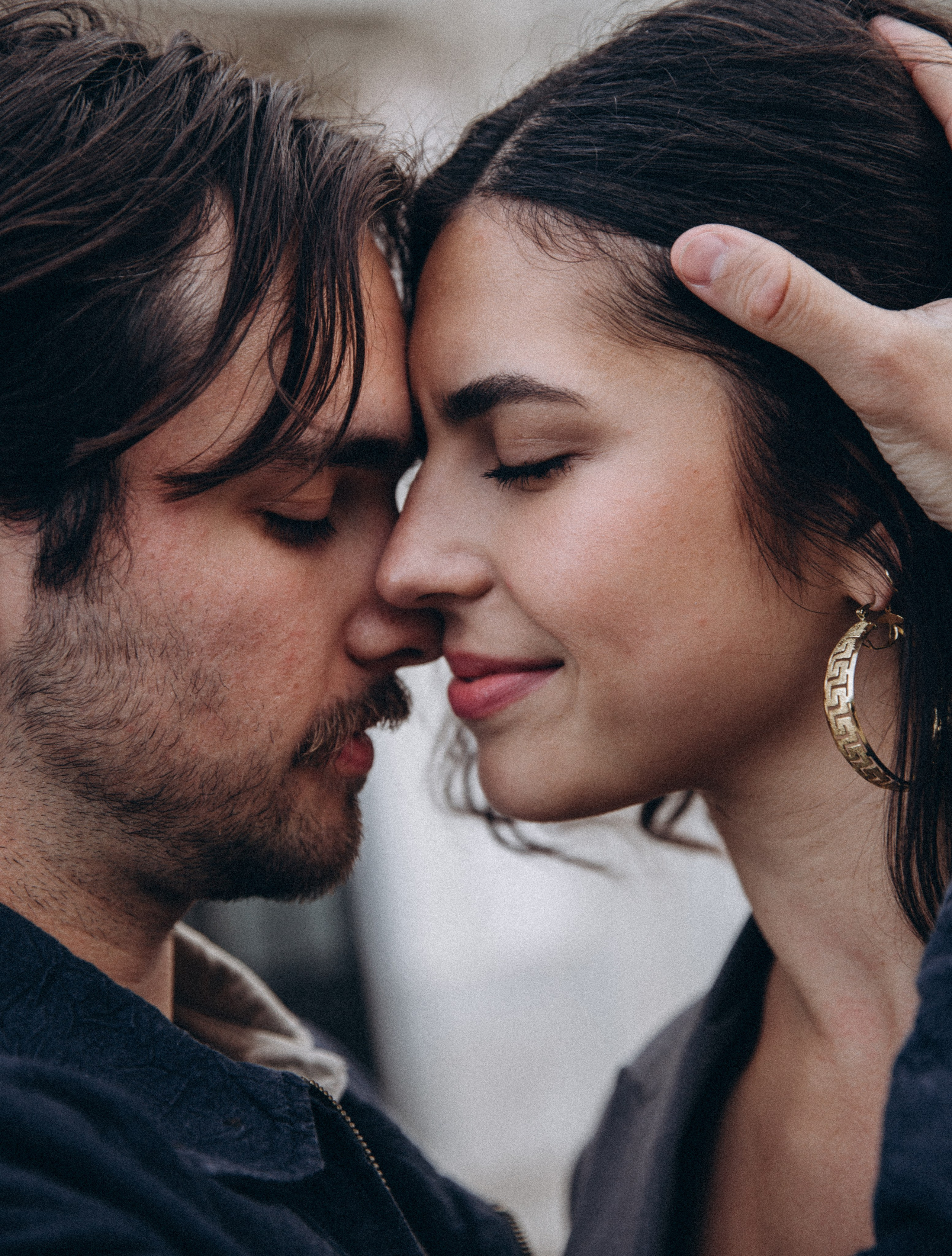 Romantic close-up of a couple embracing forehead to forehead during a love story photoshoot in Madrid, Spain — perfect for those seeking intimate couple photography sessions in Madrid or emotional love story photoshoots across Spain.