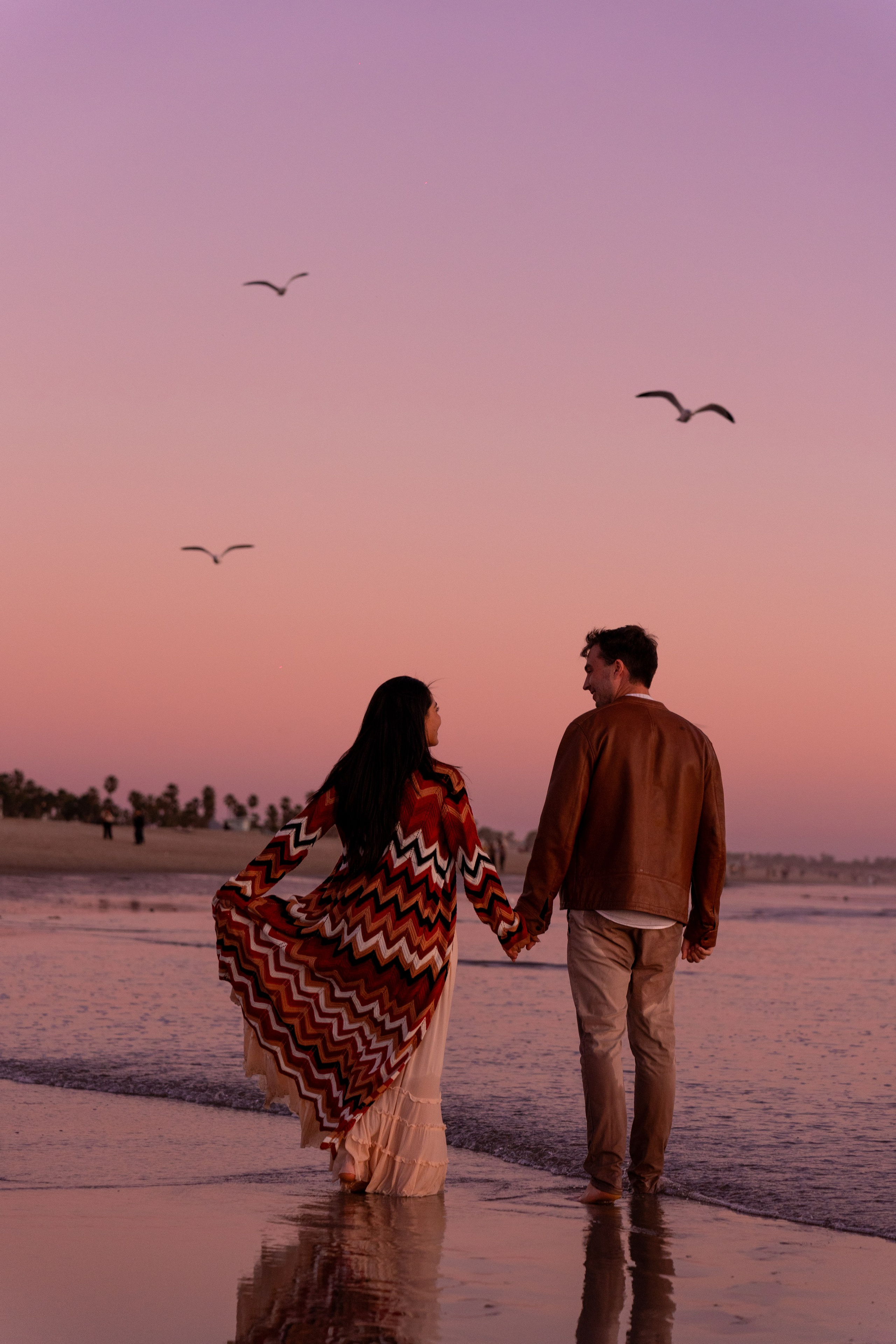 Engagement session on Santa Monica beach with a couple during sunset