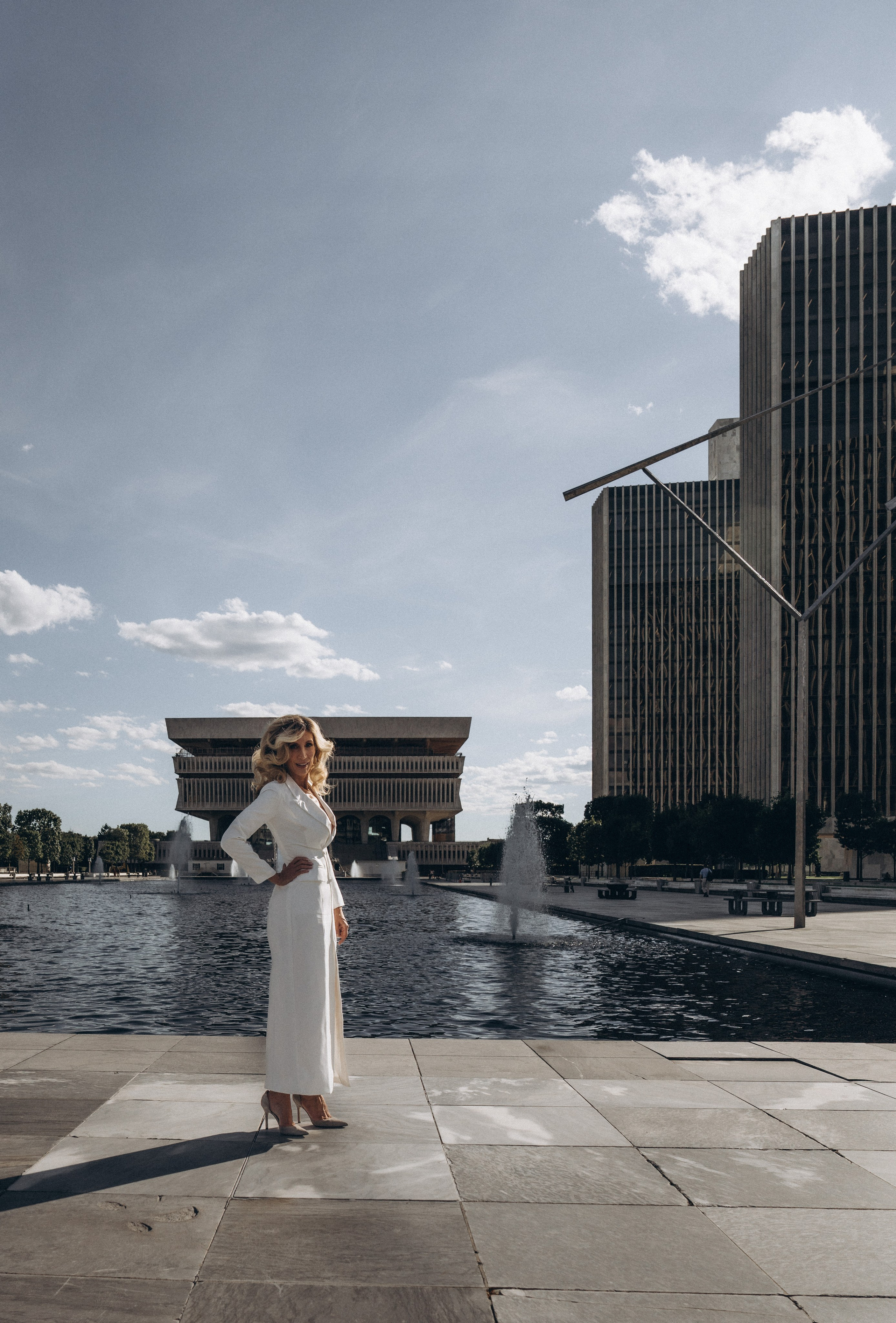 Bride in cathedral gown on Adirondack scenic overlook.