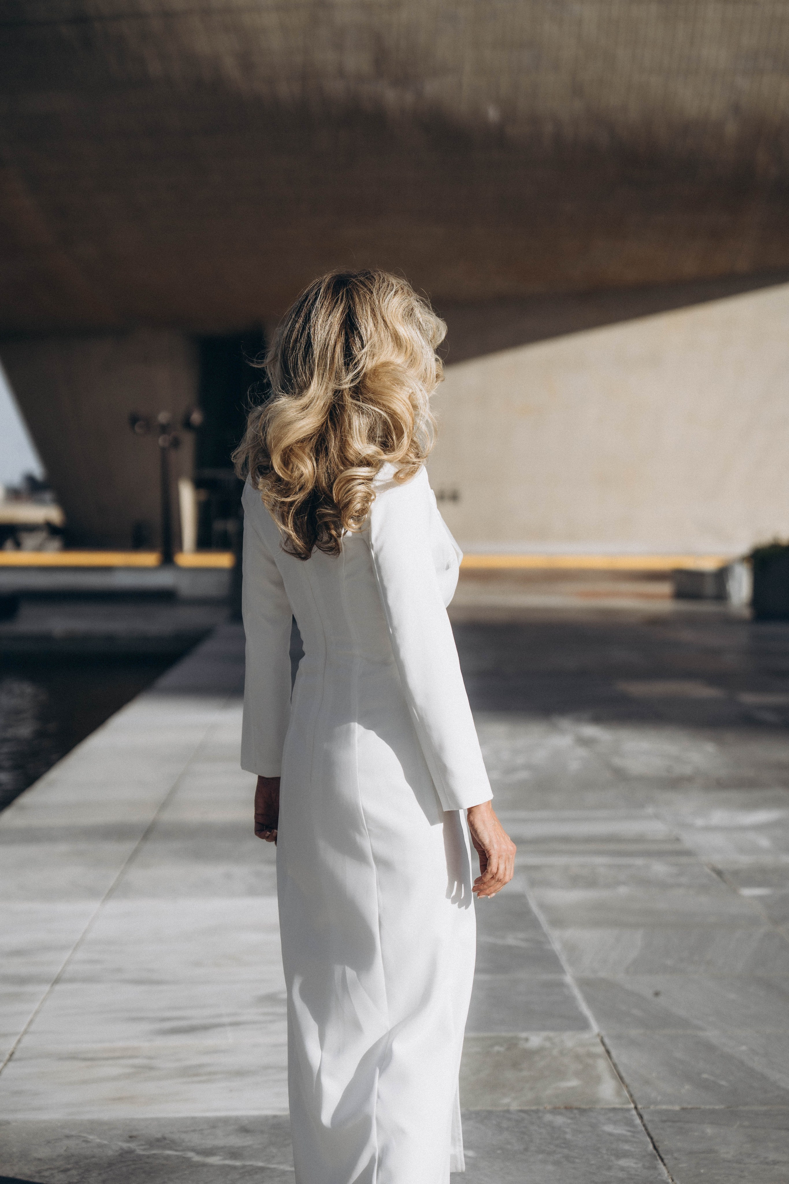 Bride twirling dress in Albany historic district street.