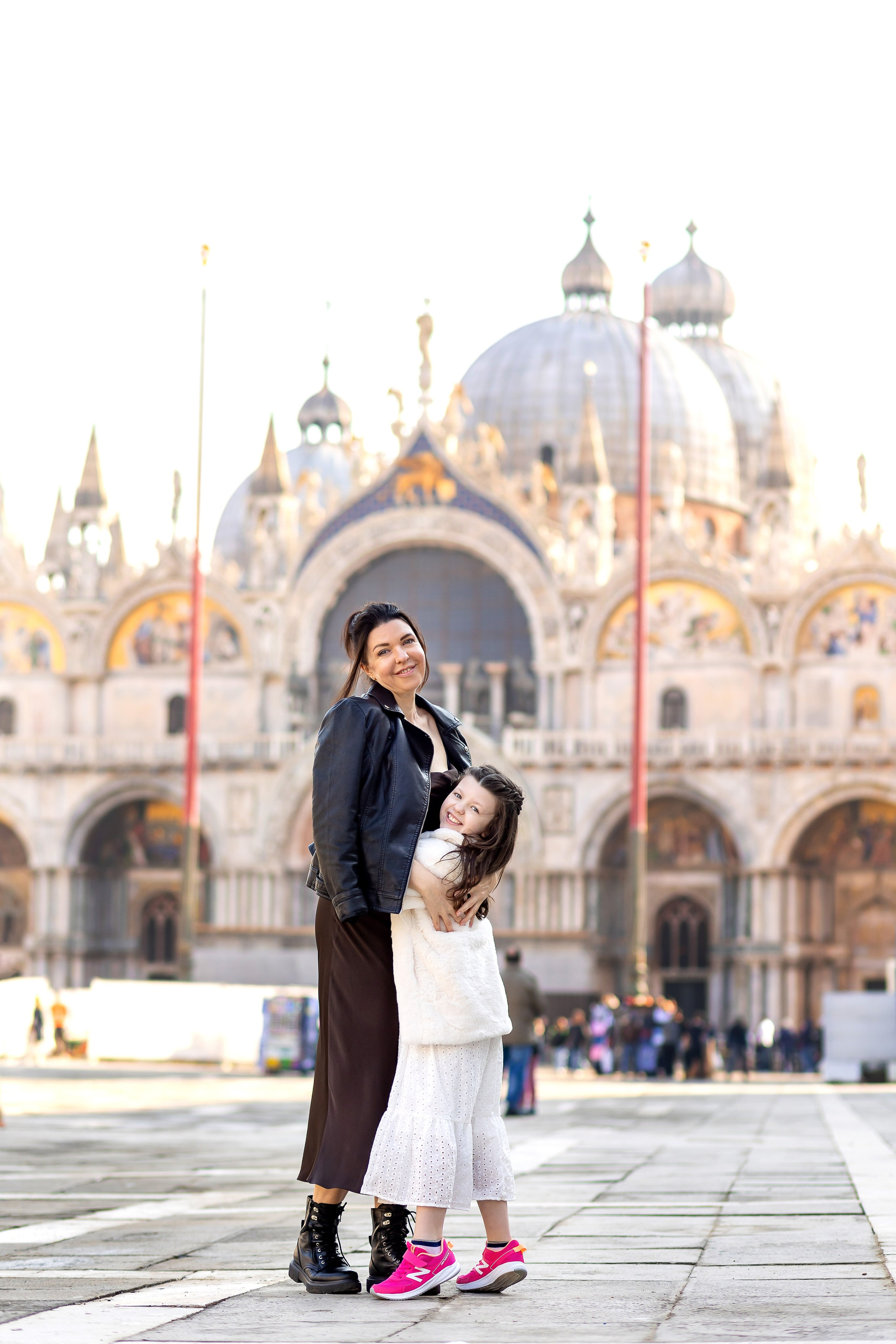 Mother and daughter at sunrise