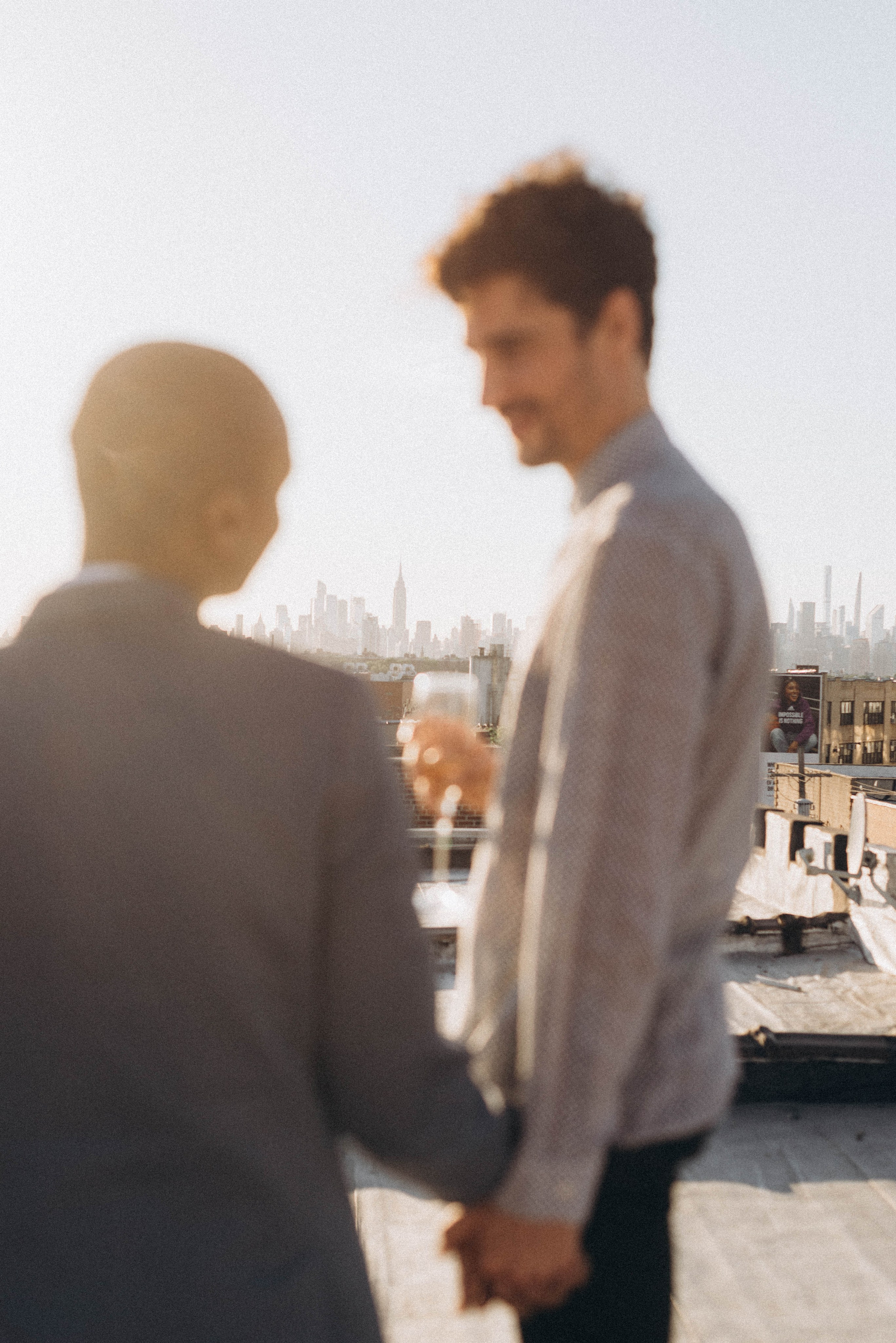 Proposal moment with Manhattan skyline sunset view.
