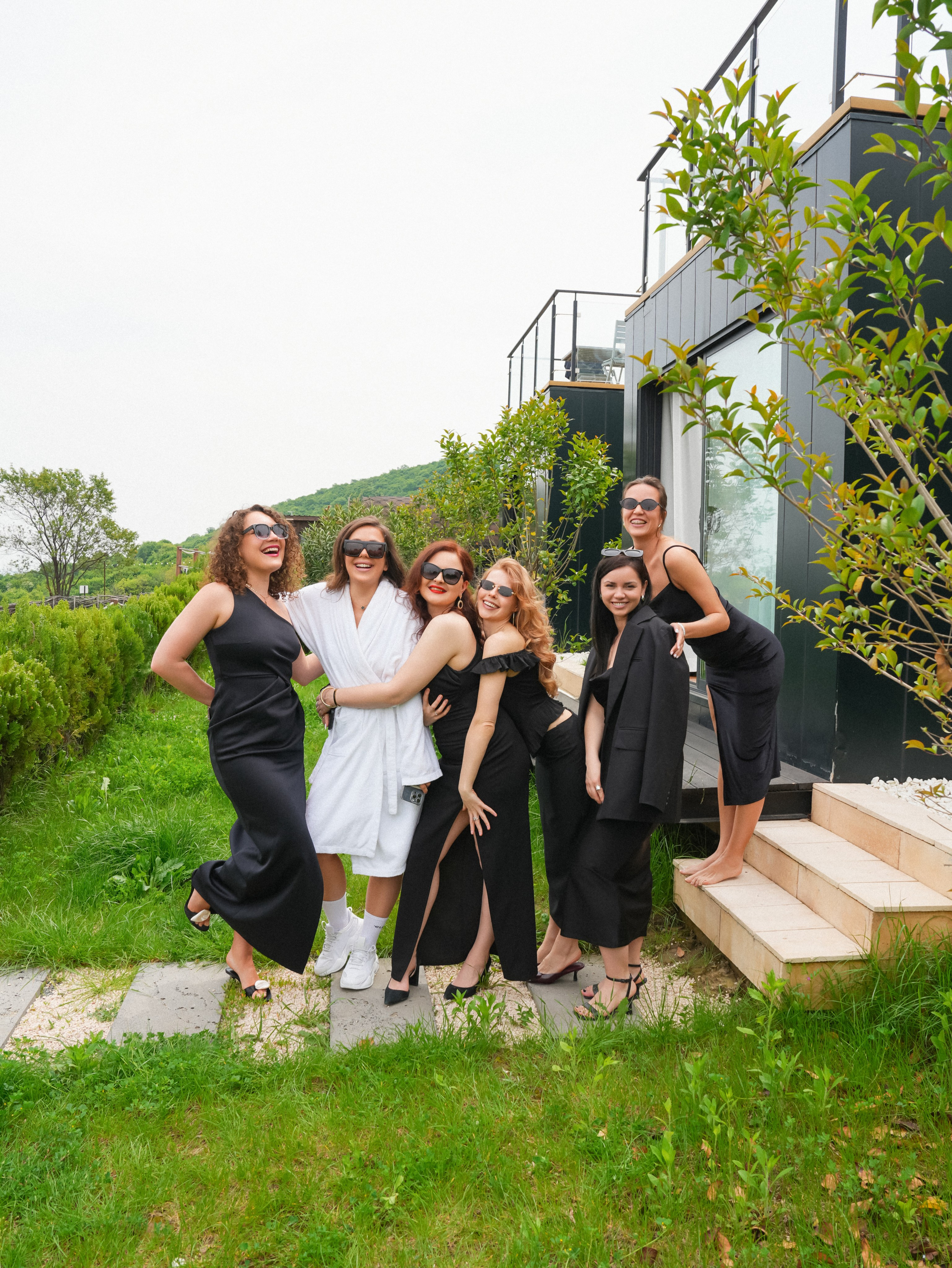 Bridesmaids posing in garden before wedding