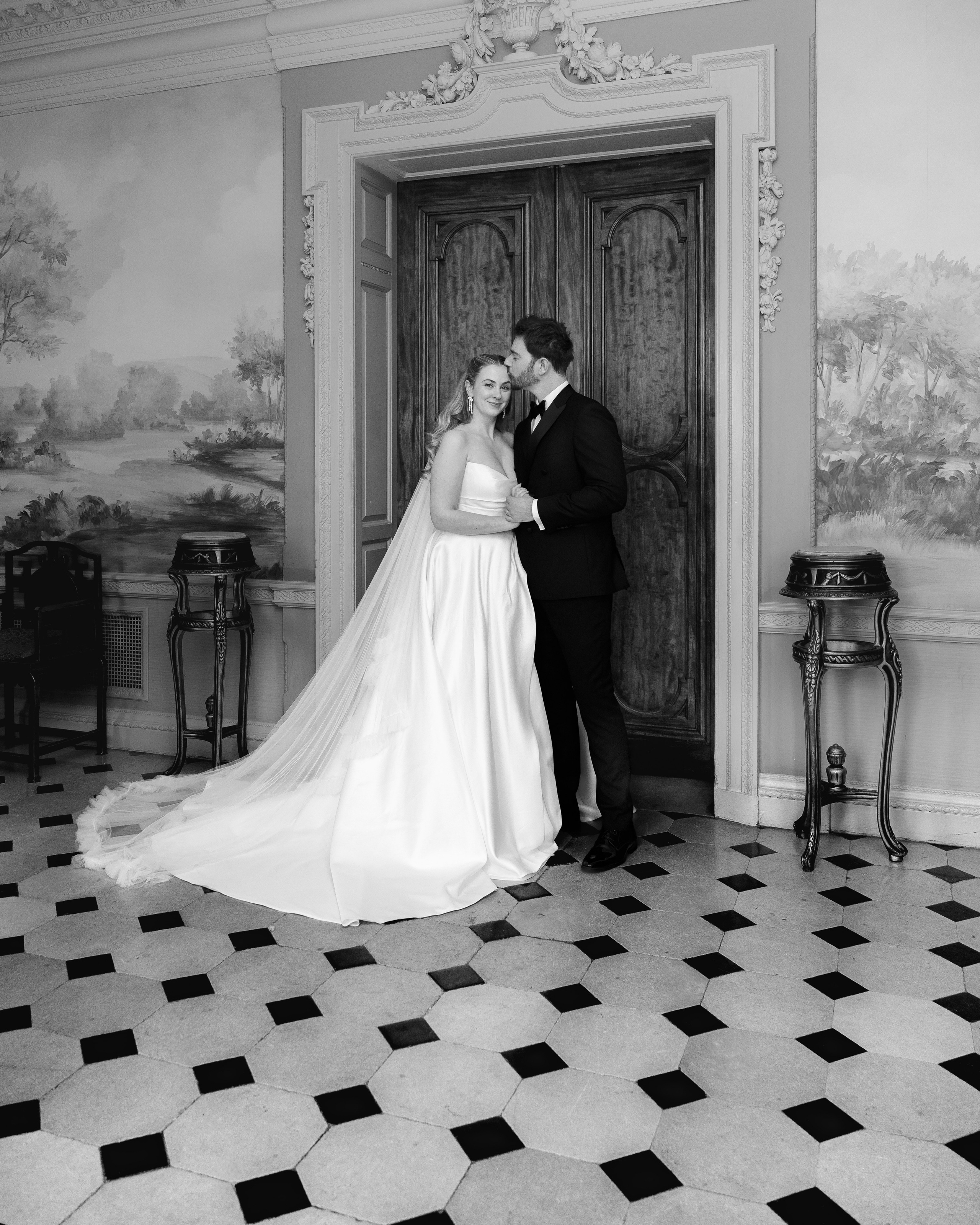 Elegant wedding portrait of bride and groom walking through the streets of ParisRomantic elopement moment captured in soft evening light in Paris, FranceLuxury wedding ceremony setup in a historic French venue with natural floralsCandid black and white photo of a couple at their city wedding in London, UKTimeless couple portrait in front of Marylebone Town Hall, LondonEditorial-style bridal preparation in a classic townhouse in the heart of LondonSoft light bridal portrait in a countryside château wedding in FranceFine art flat lay with French-inspired wedding details and vintage texturesCinematic golden hour photo at a UK estate wedding with historic architectureLuxury wedding tablescape with candles and florals at a London reception