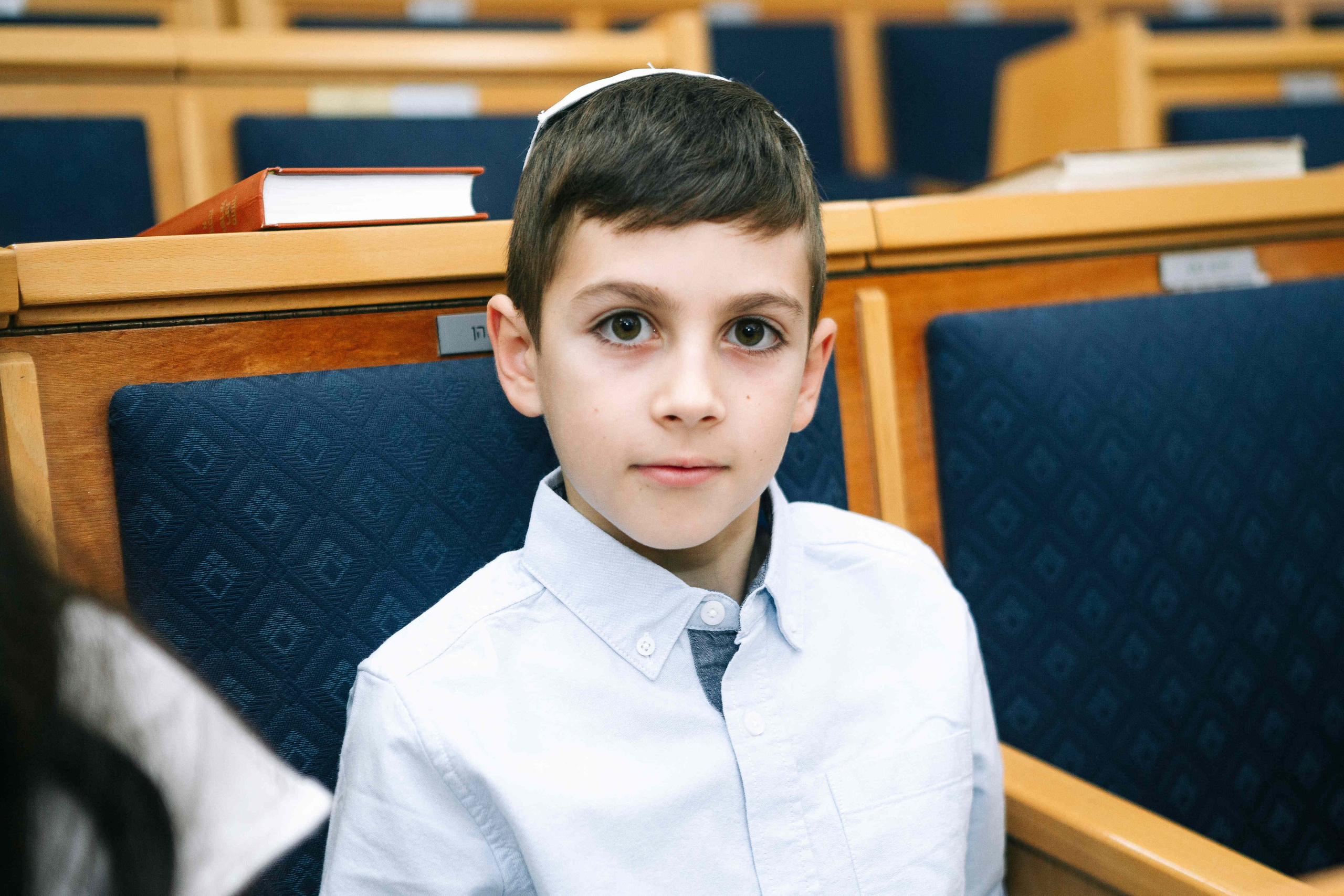 BRITH MILA IN THE SMALL SYNAGOGUE. PHOTOGRAPHER IN ISRAEL