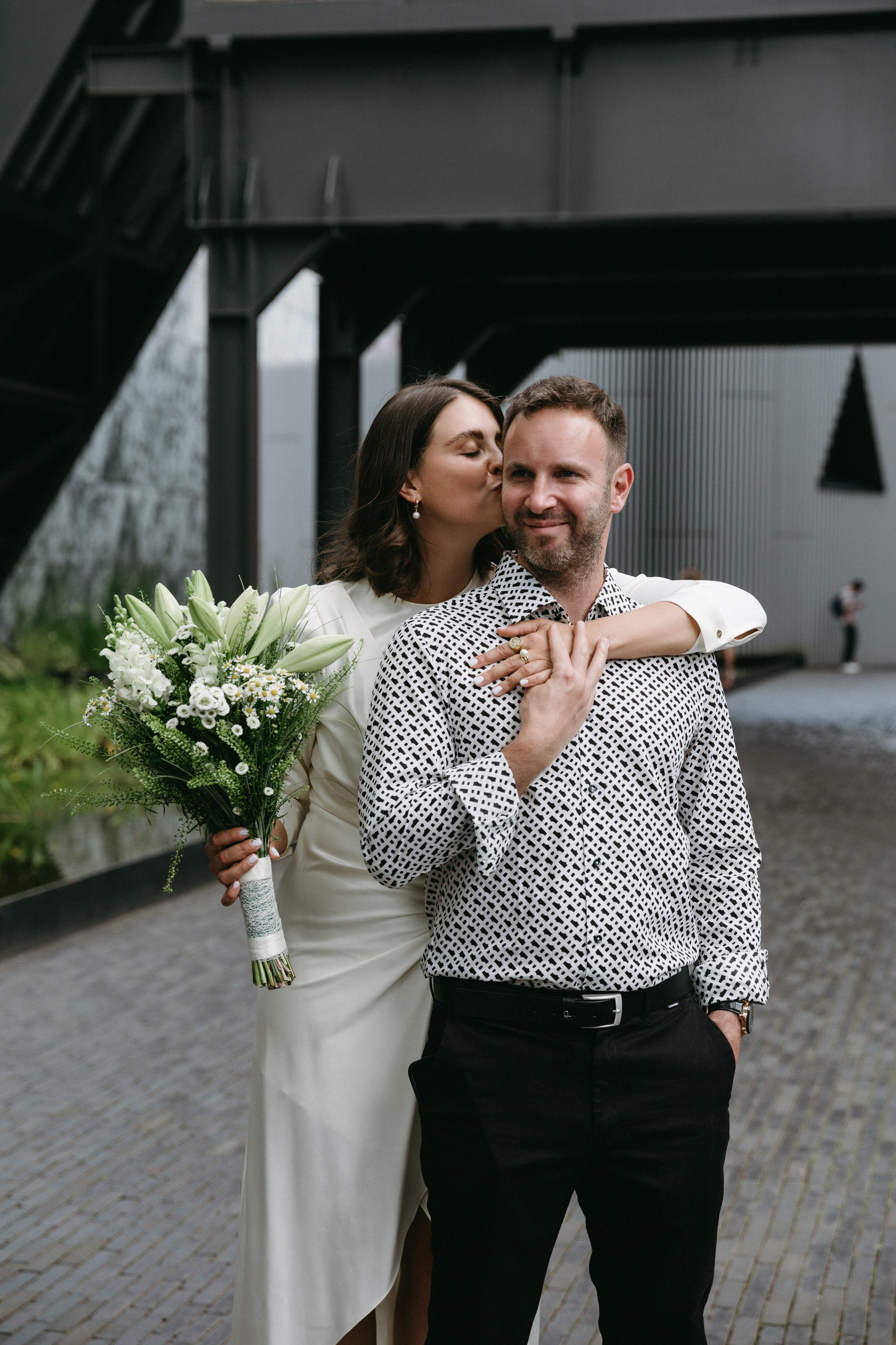 Bride kisses groom after civil wedding in Esch-sur-Alzette
