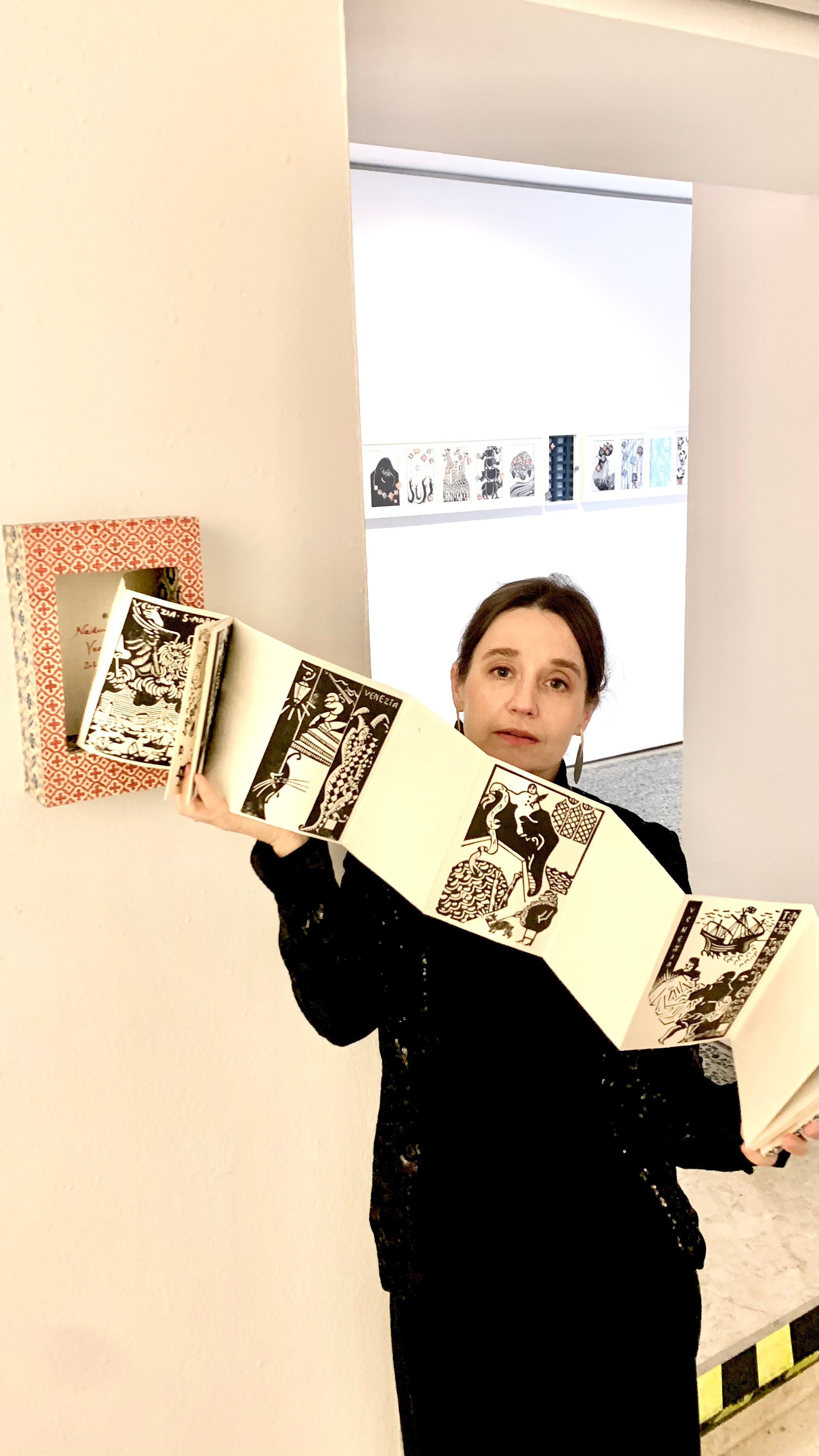 Nadia Kuprina with her artist book Leporello Veneziano at the Illustration Exhibition in Venice, January 2025
