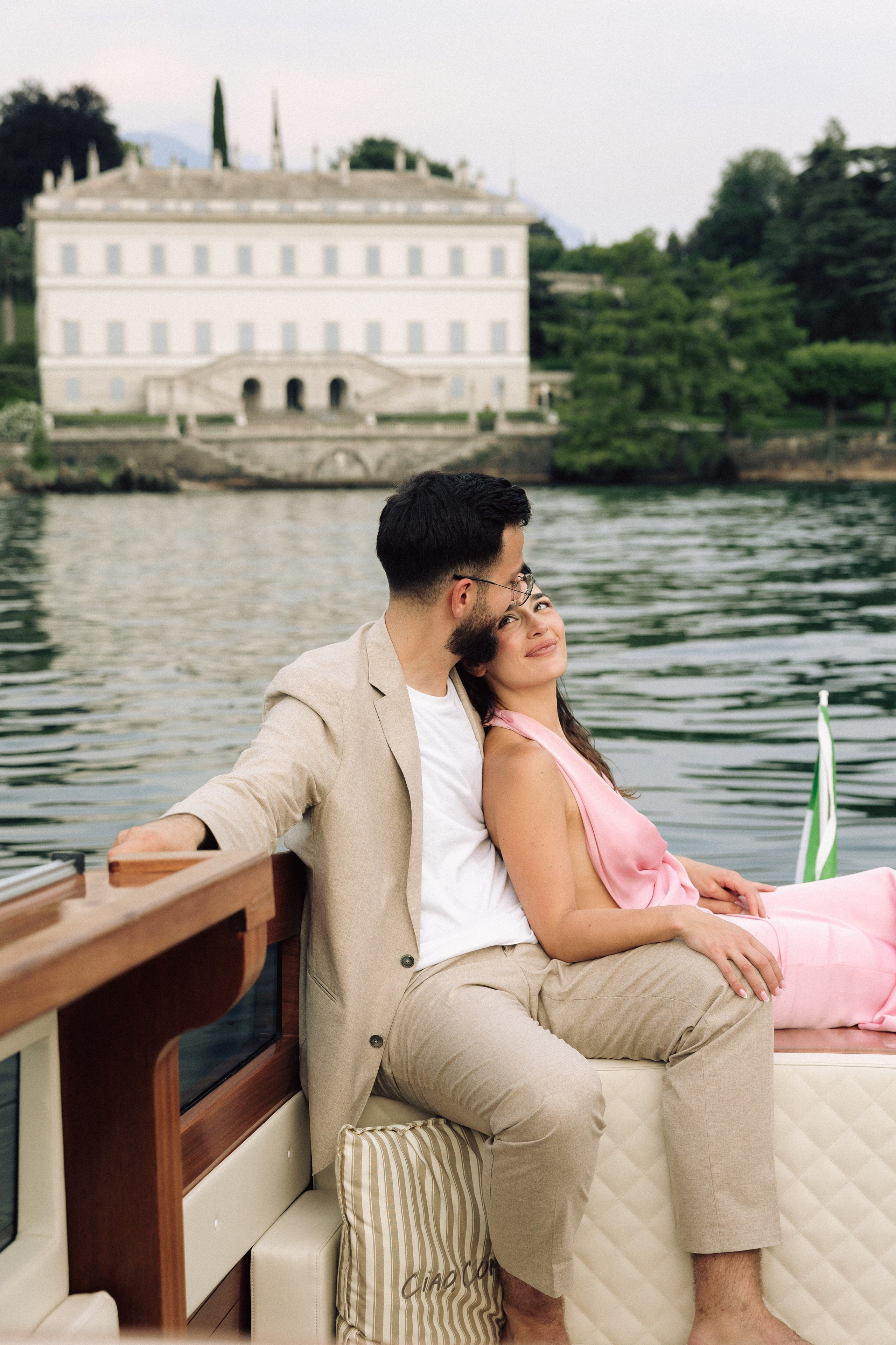 Newly engaged couple cruising past Villa Melzi on Lake Como, Italy