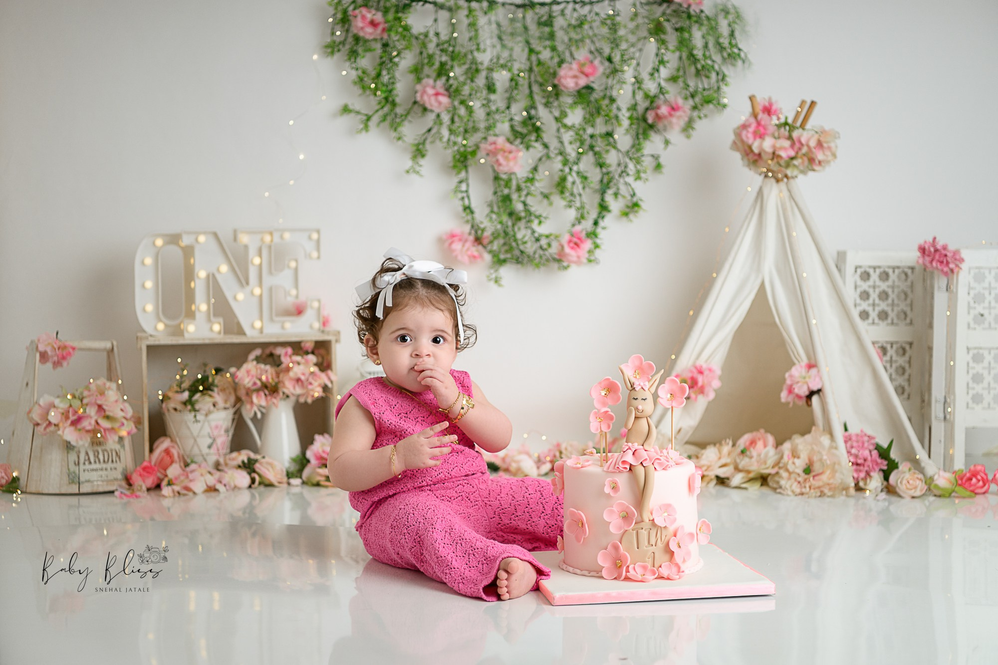 adorable little girl in pink colour with beautiful boho background.
