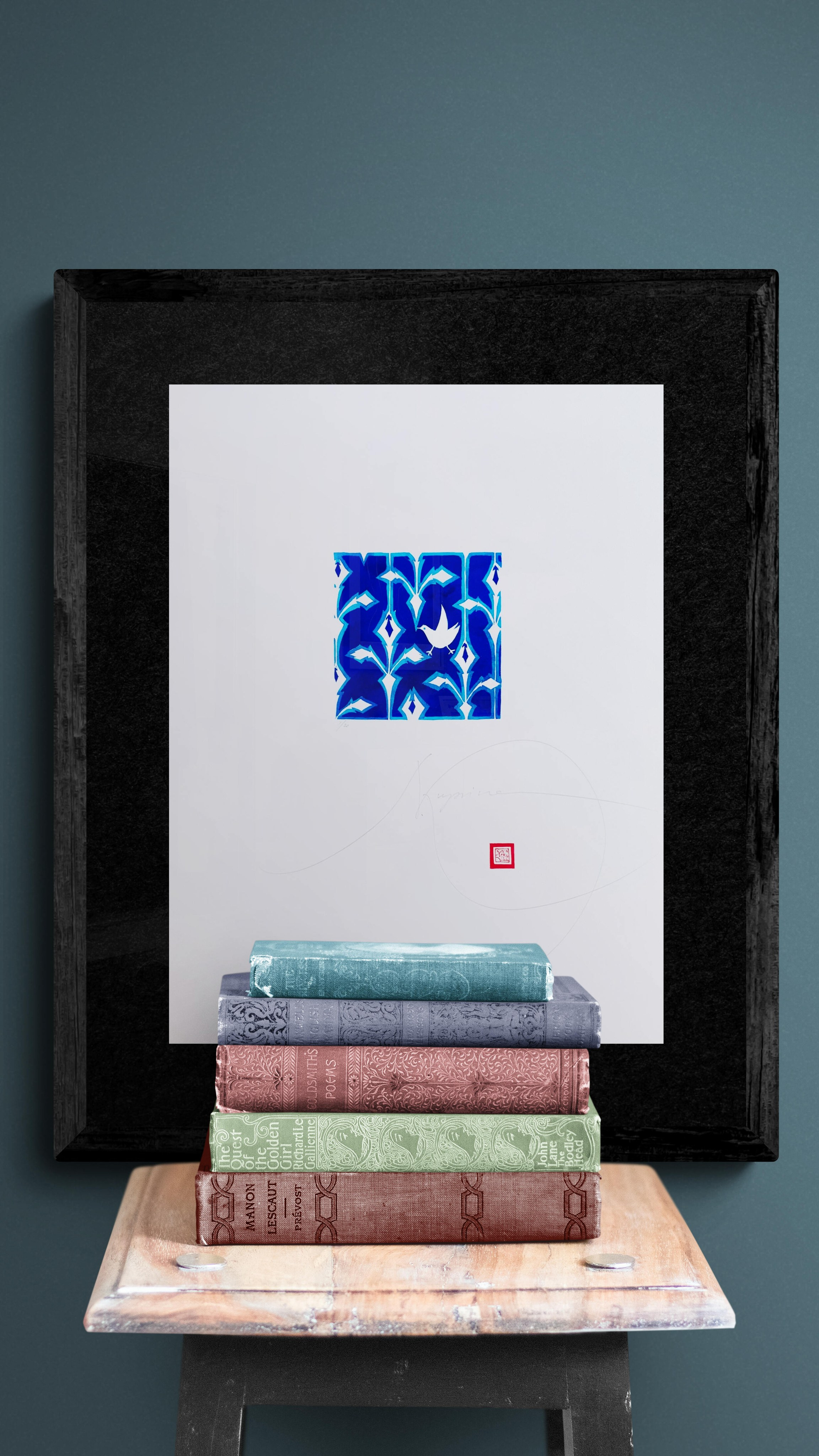 Decorative floral artwork in blue and white by Nadia Kuprina, limited edition digital print inspired by 1950s Scandinavian design and hand-painted ceramics, available on SaatchiArt. Framed sample with books.