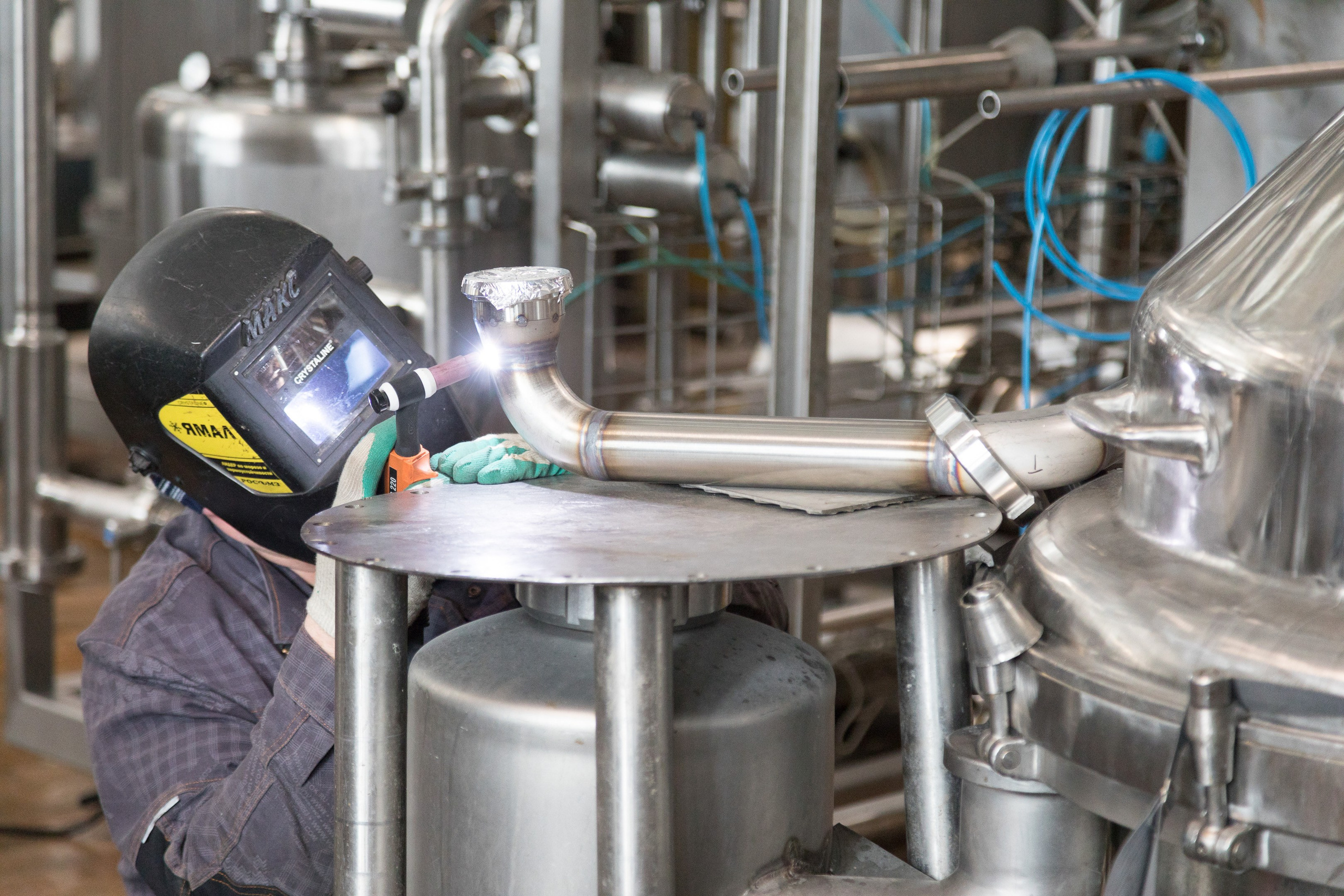 Welder at work in industrial interior - photographer Andrey Dunin