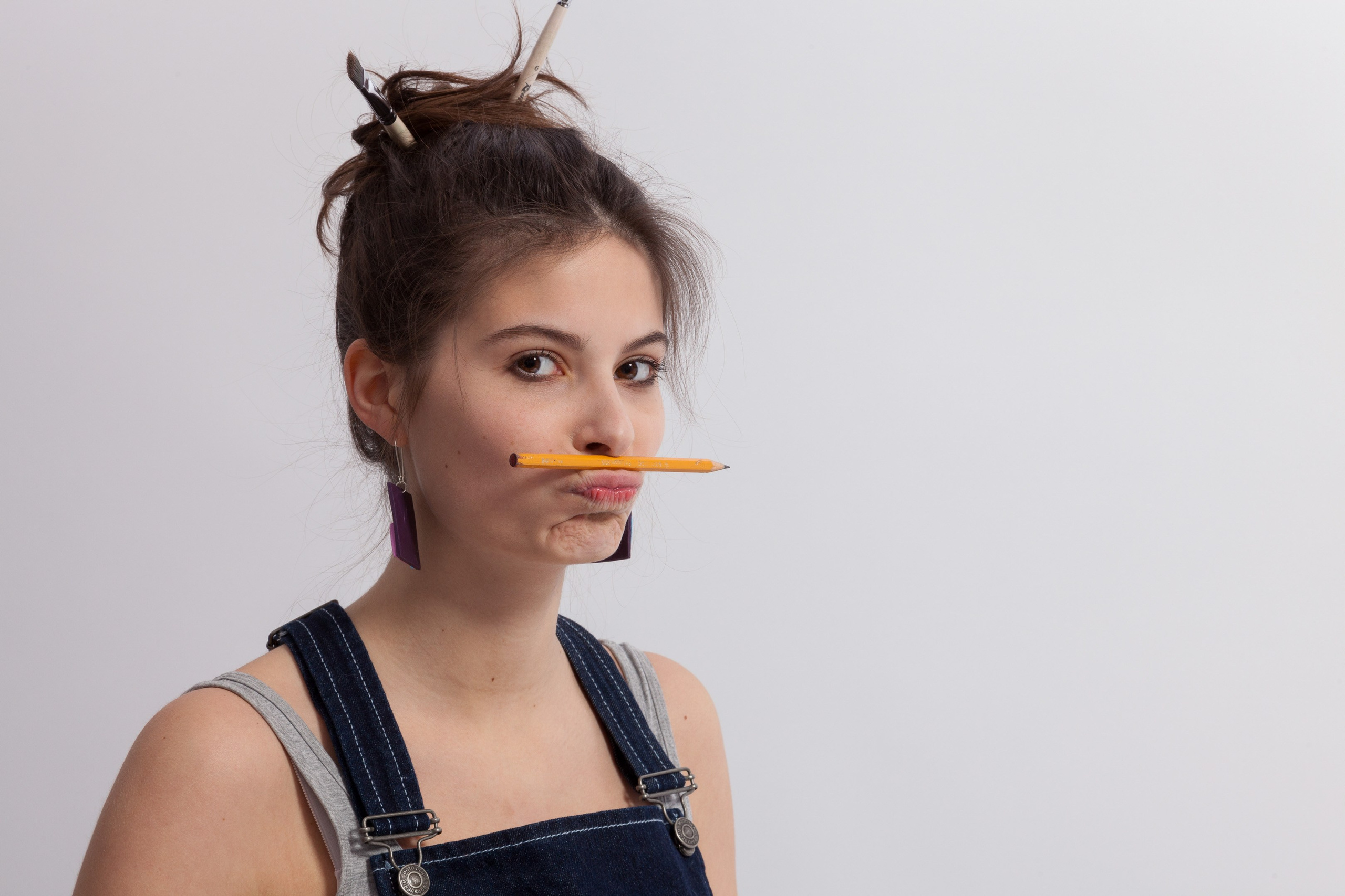 Portrait of a young artist girl on white studio background - photographer Andrey DuninPortrait of a young artist girl on white studio background - photographer Andrey Dunin