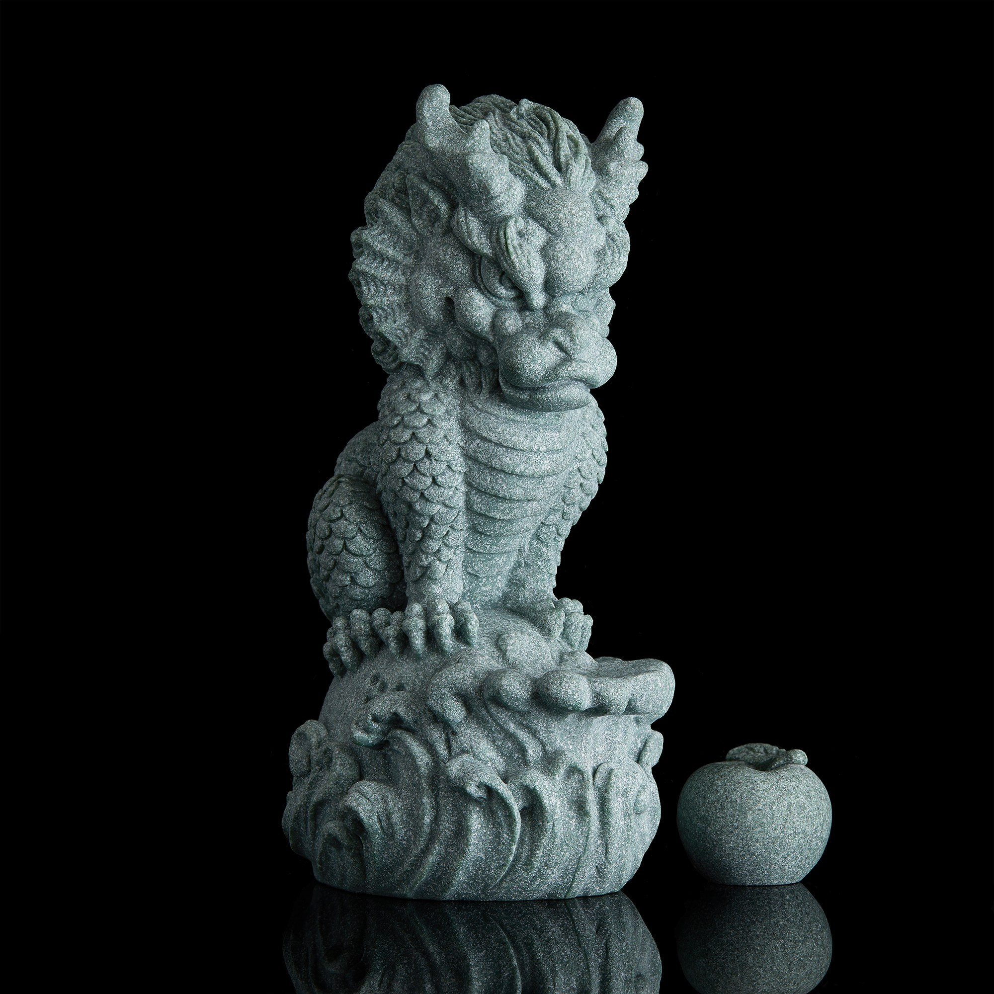 Photographer Roman Djuzev - Stone sculpture of dragon, a magical animal of Chinese mythology that brings good luck, on black background.