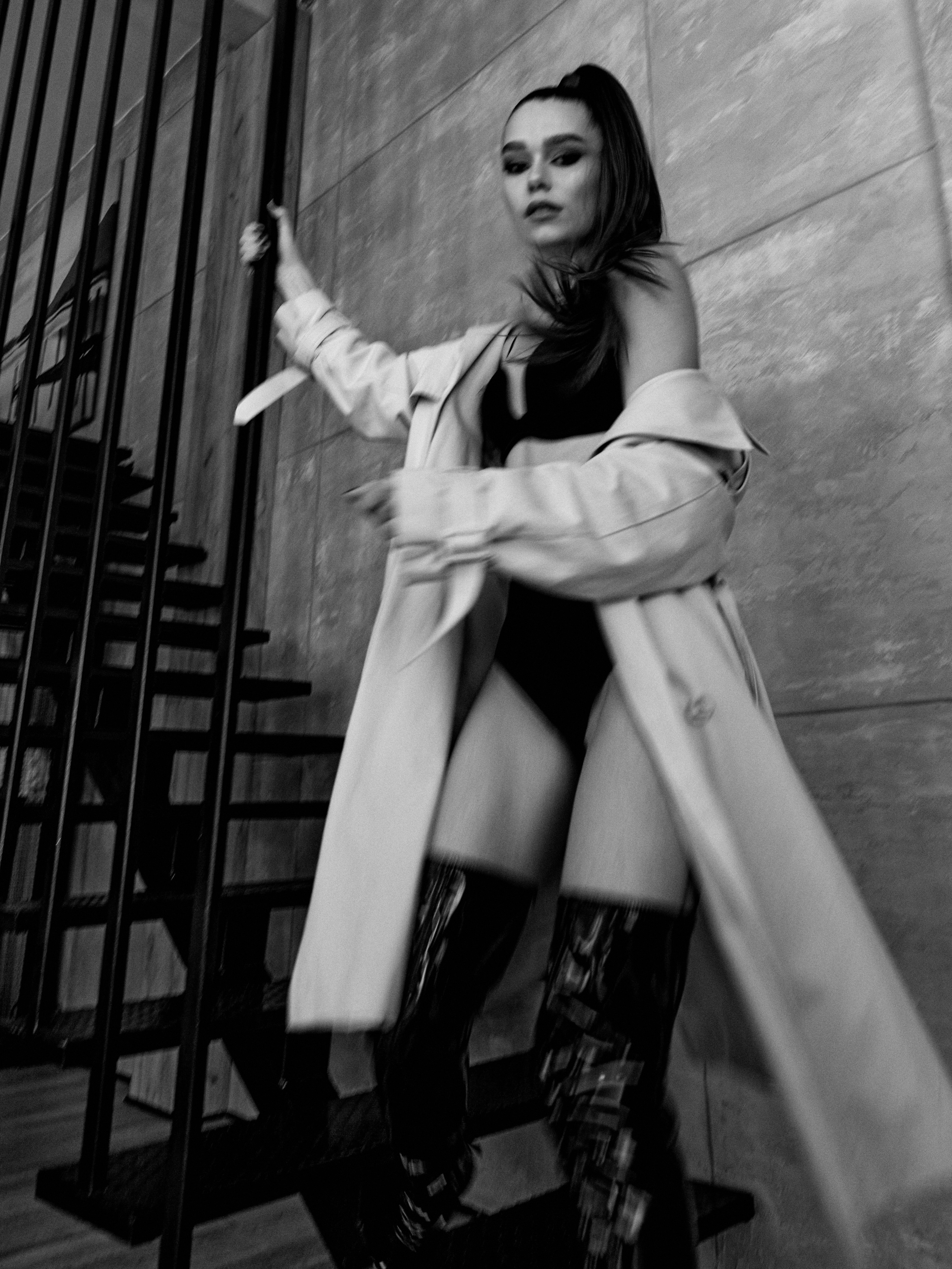 Black and white photography, woman wearing a body and a coat