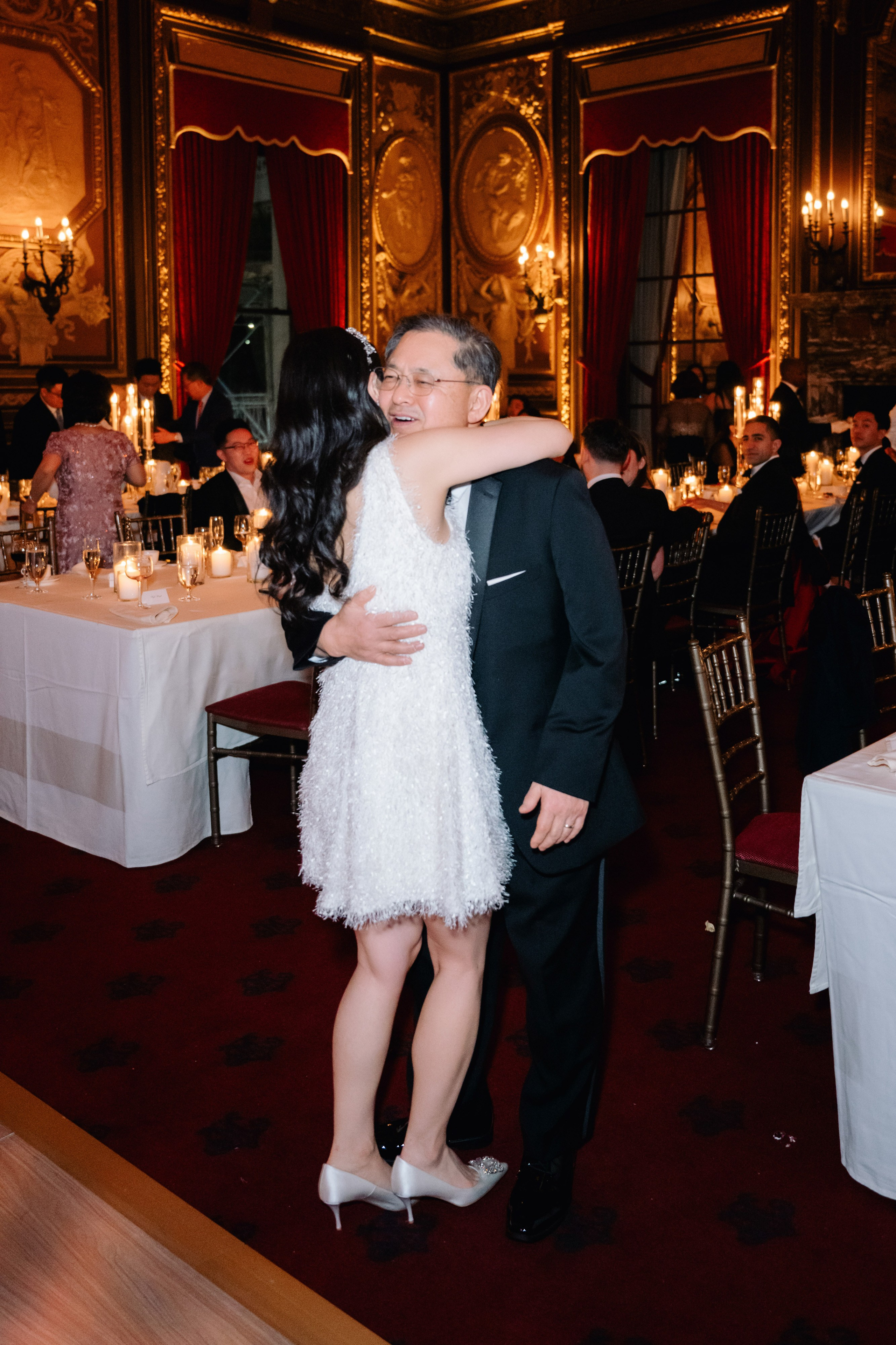 a man and woman are kissing in a room