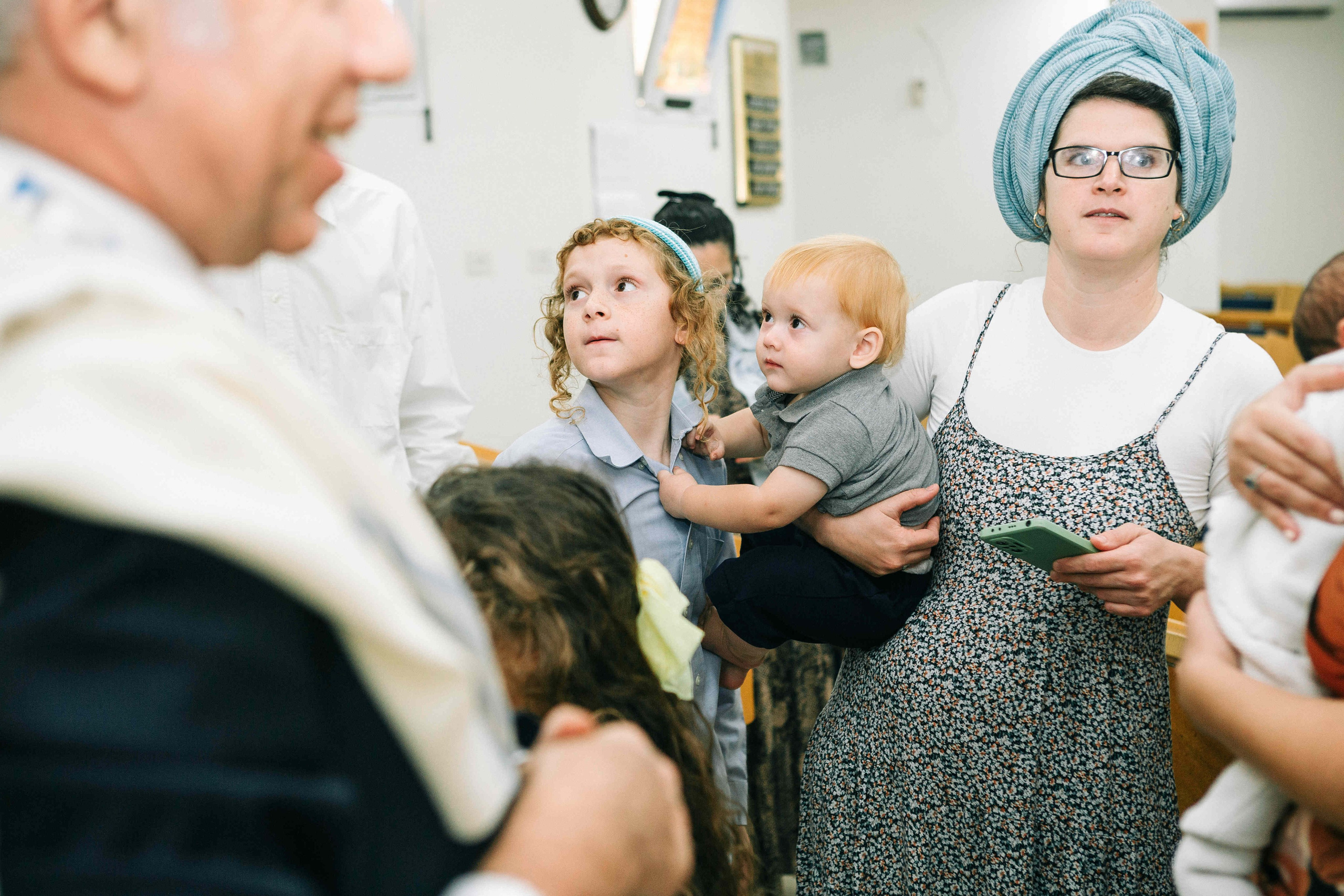 BRITH MILA IN THE SMALL SYNAGOGUE. PHOTOGRAPHER IN ISRAEL