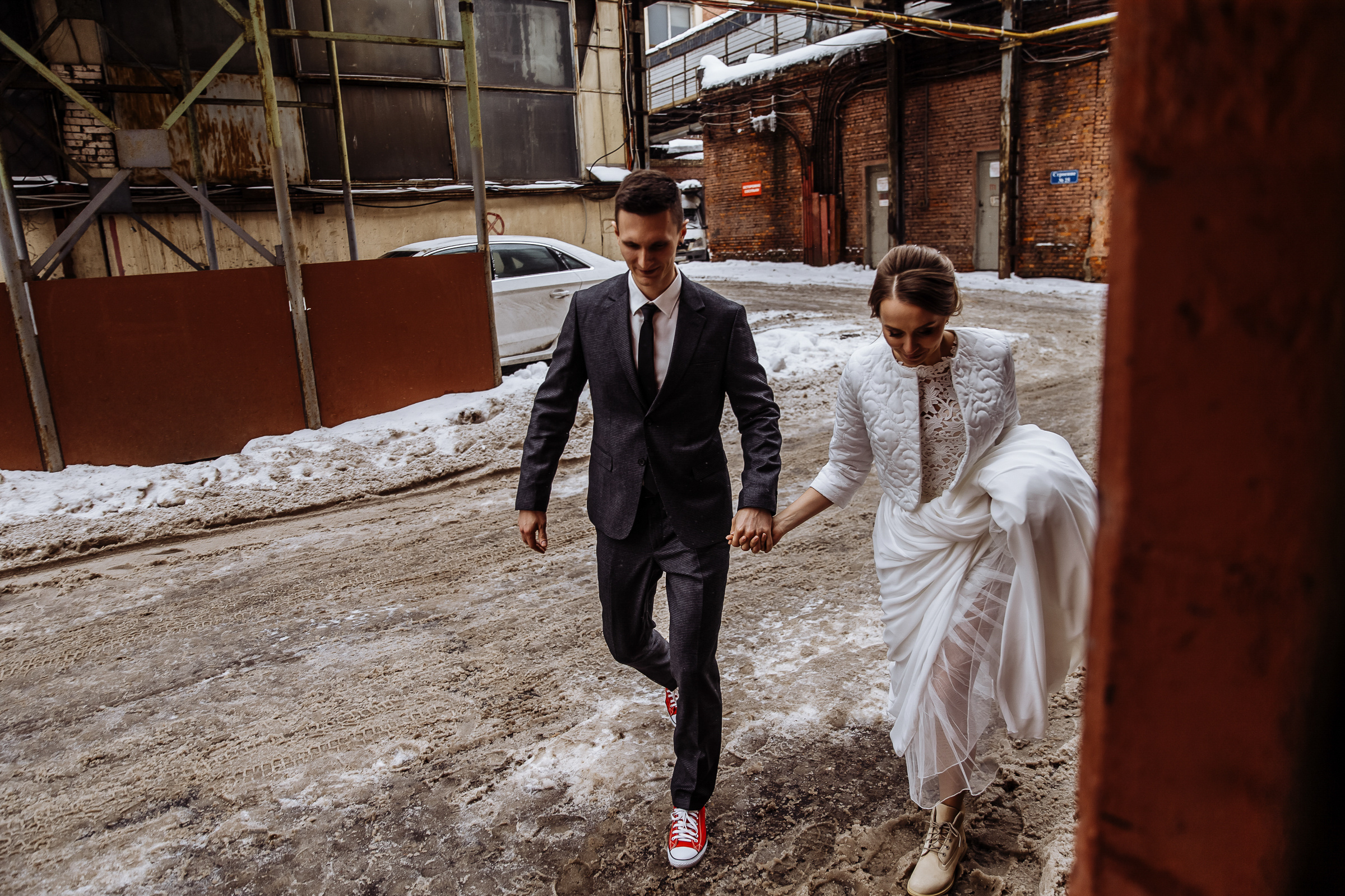 Bride and groom walk to photo studio, by Tanya Bogdan, Bude wedding photography.  