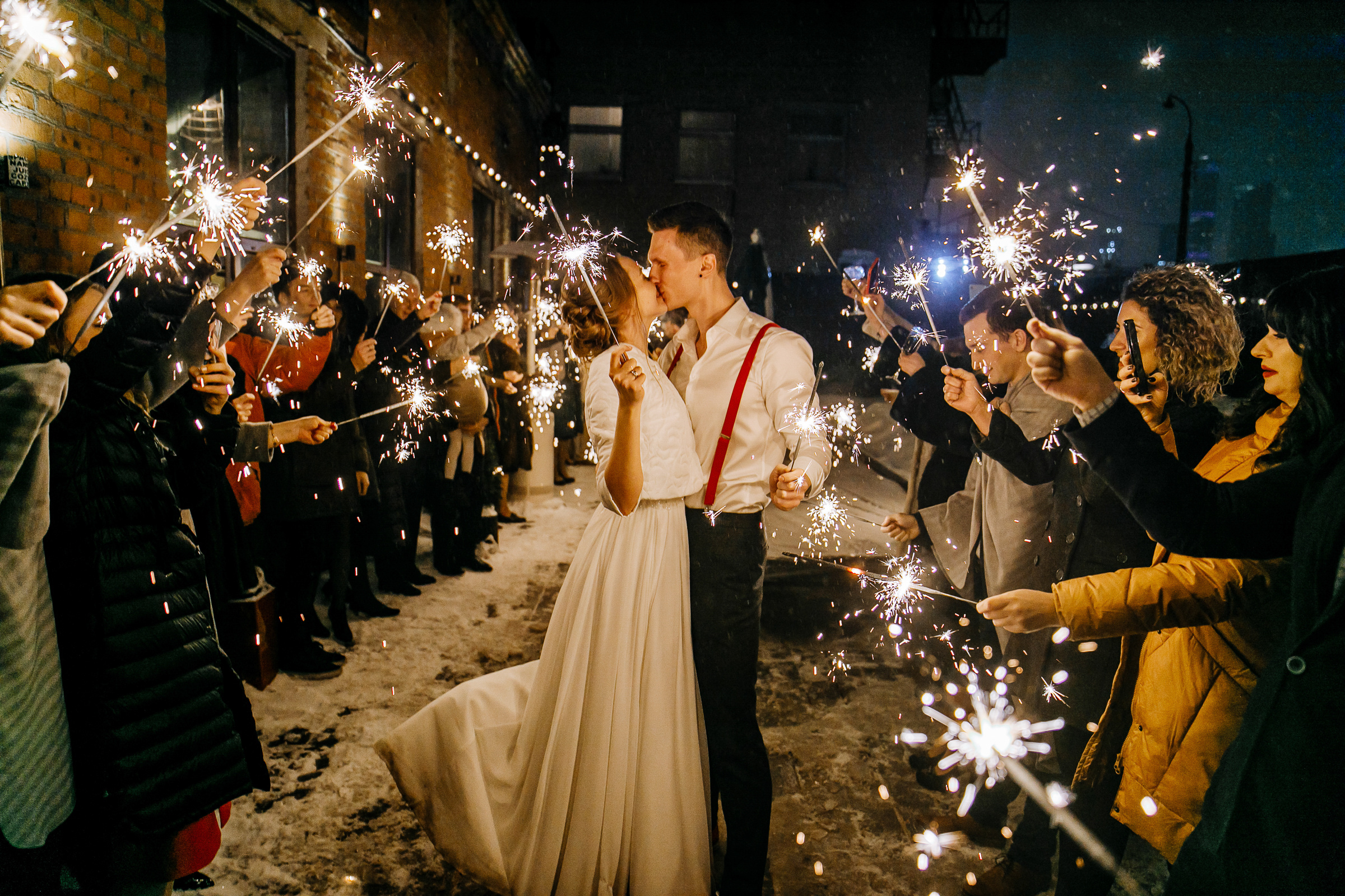 Couple with sparklers kissing, by Tanya Bogdan, Bude wedding photography.  
