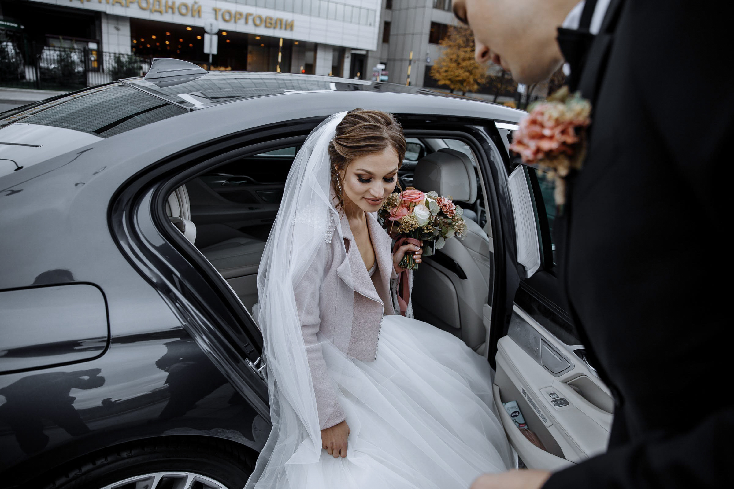 Bride arriving by car, by Tanya Bodgan, Bude, Cornwall wedding photographer.  