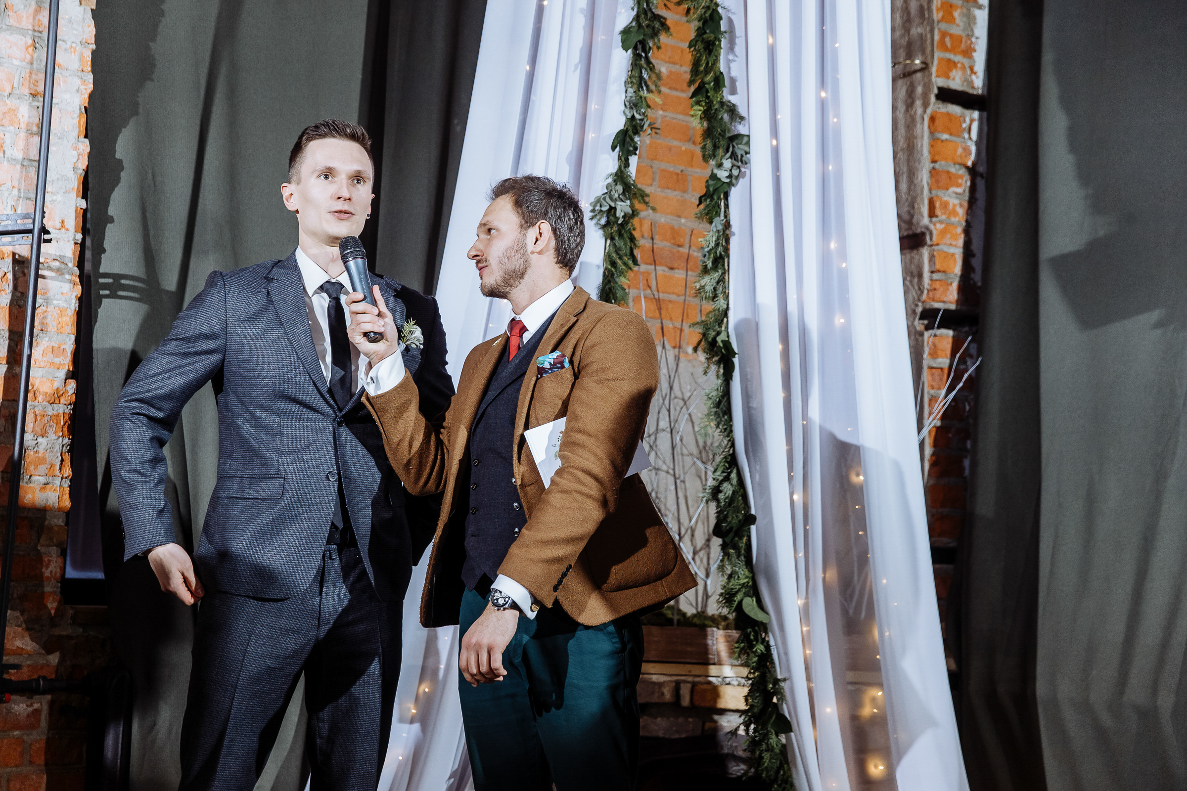 Groom greeted by celebrant, by Tanya Bogdan, Bude  wedding photography.  
