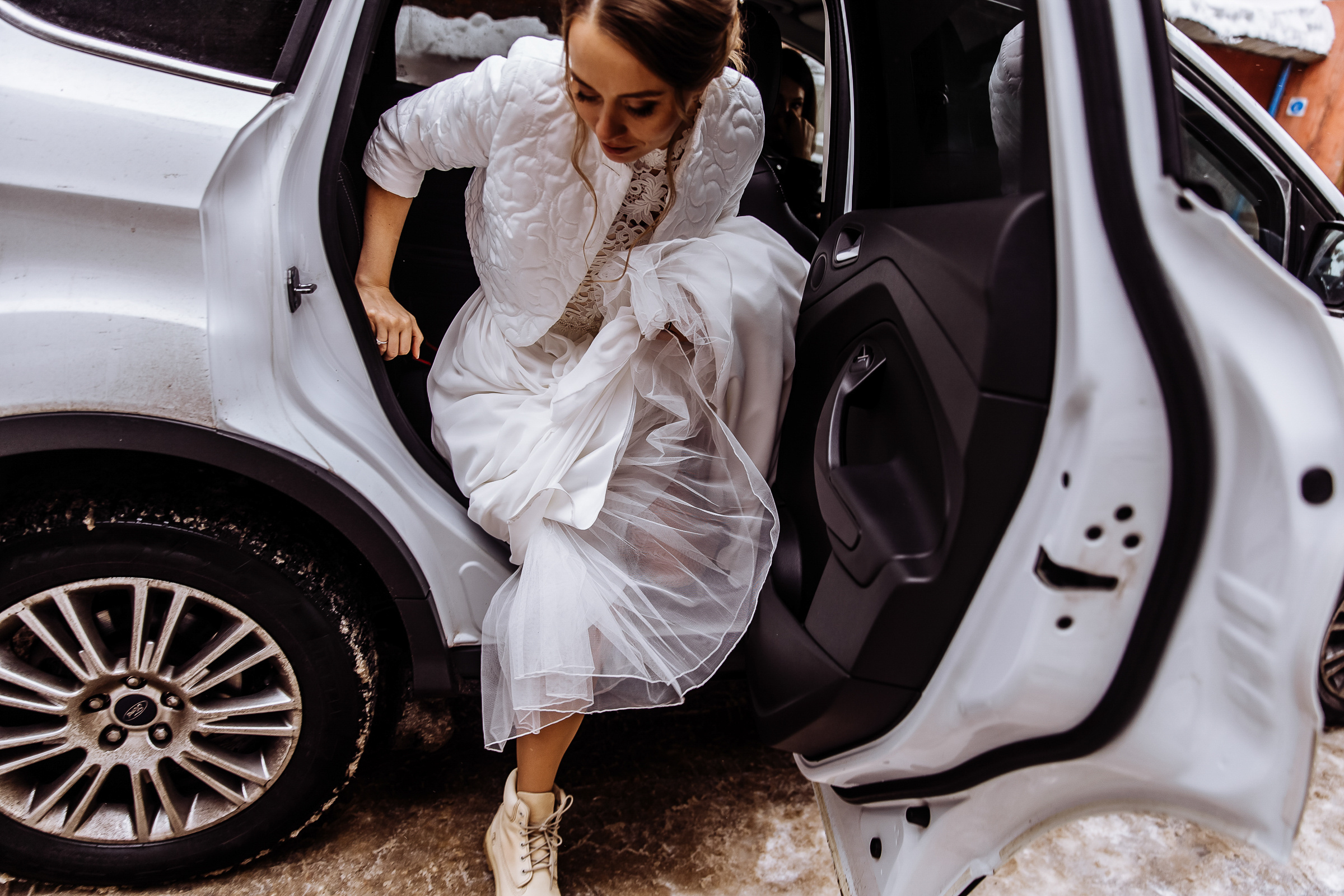 Bride exits car, by Tanya Bogdan, Bude wedding photography.  