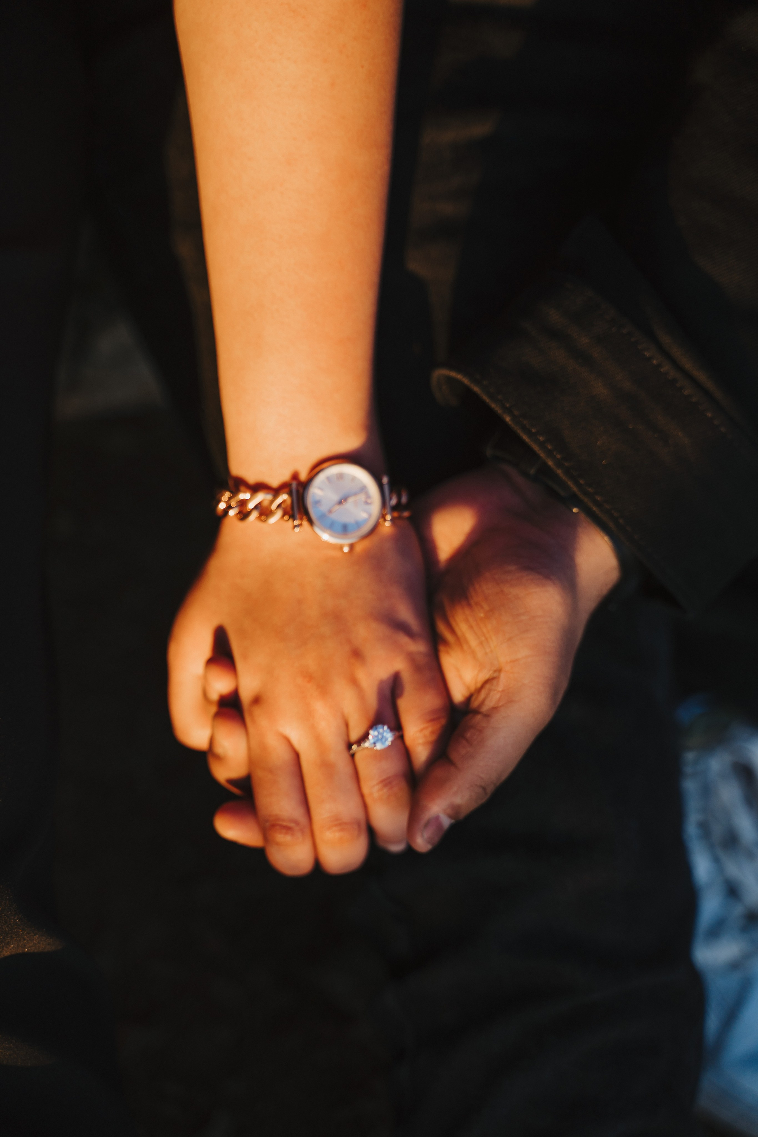 Proposal.  Overlooking the golden San Franisco Bridge sunset with a couple. Photographer Video. 