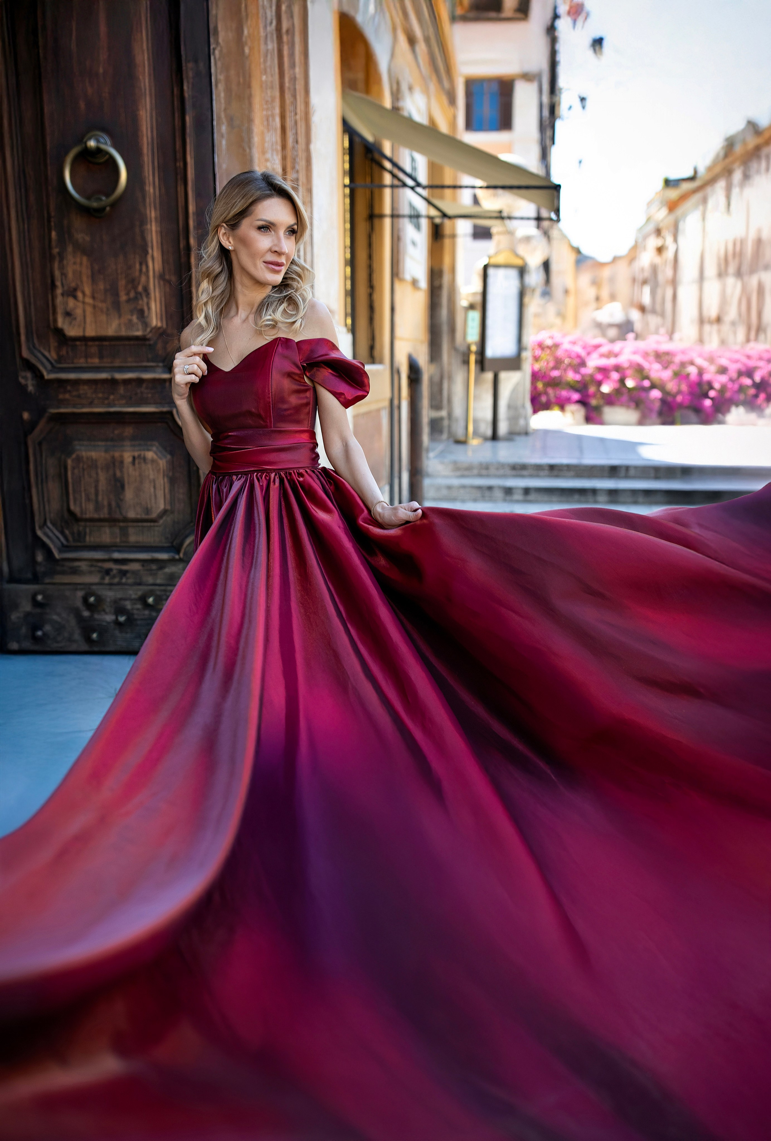 Woman in a flying dress during a photoshoot in Rome