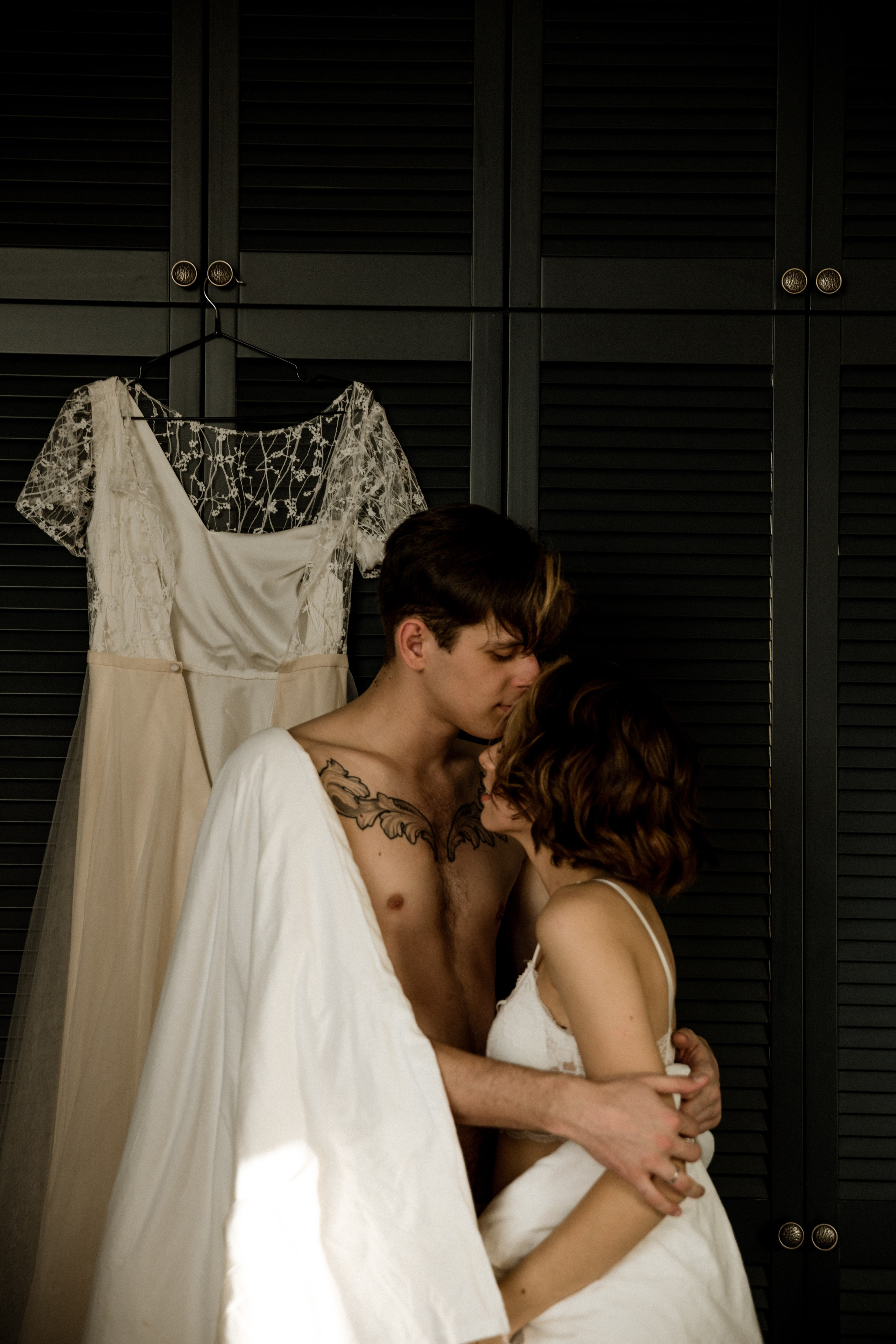 Seaside bridal shoot with long flowing veil in the wind, wedding in Spain