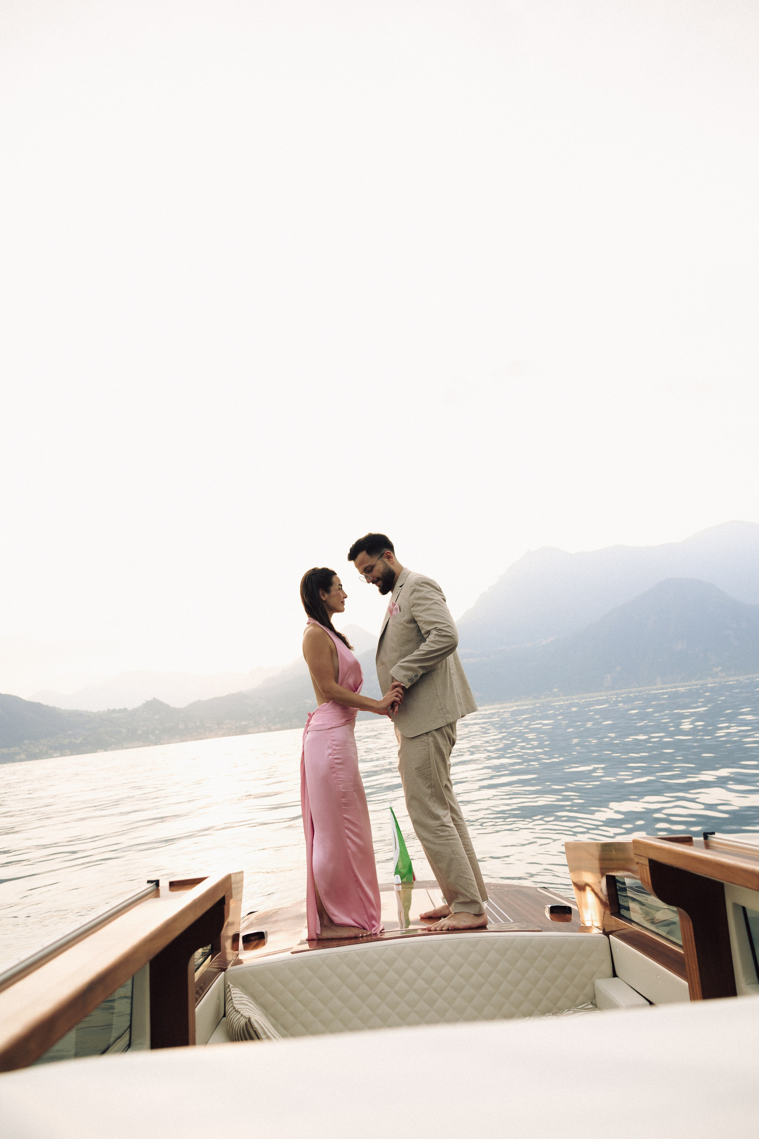Couple holding hands while exploring the beautiful surroundings of Lake Como